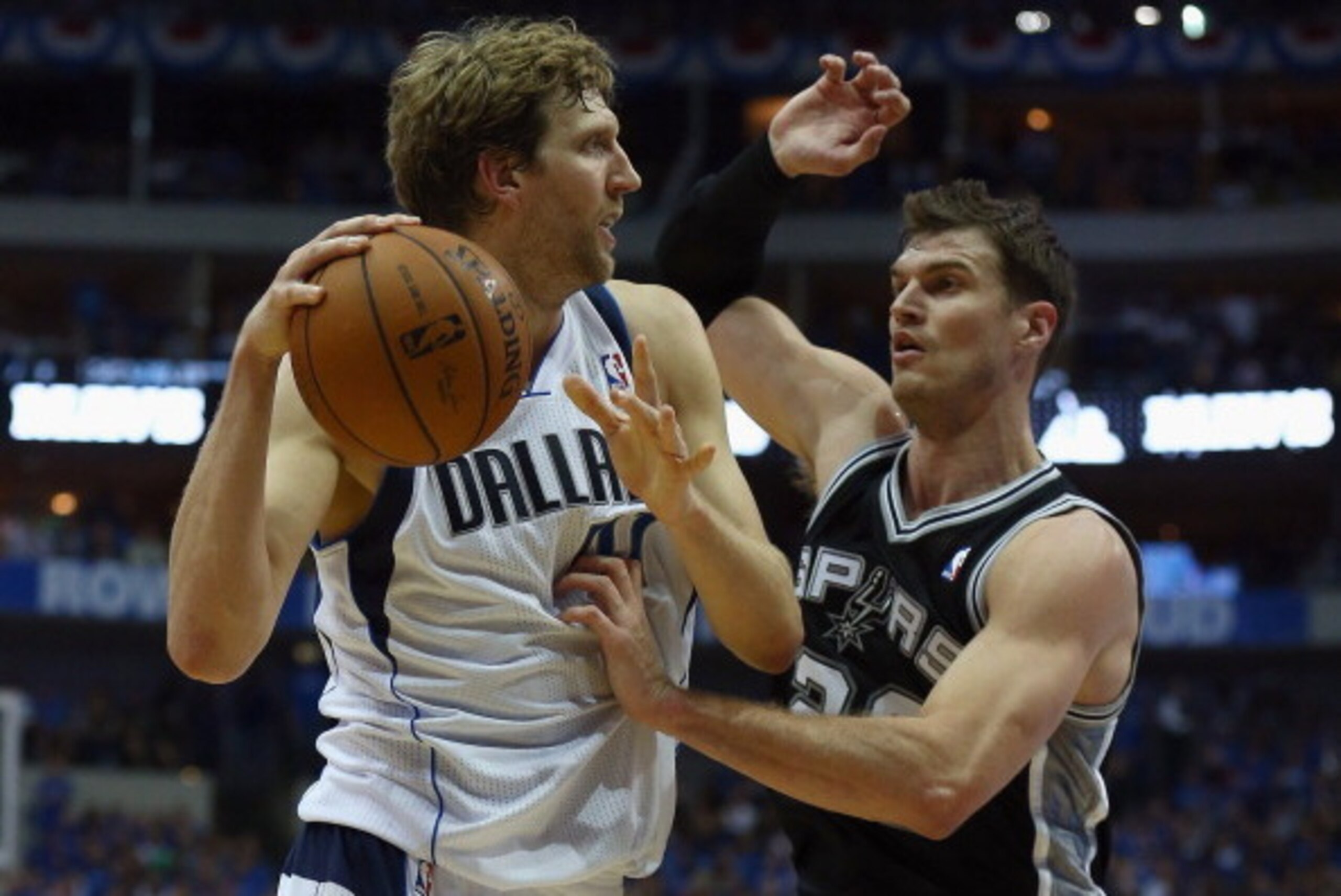 DALLAS, TX - APRIL 26:  Dirk Nowitzki #41 of the Dallas Mavericks drives to the basket against Tiago Splitter #22 of the San Antonio Spurs during Game Three of the Western Conference Quarterfinals during the 2014 NBA Playoffs at American Airlines Center o