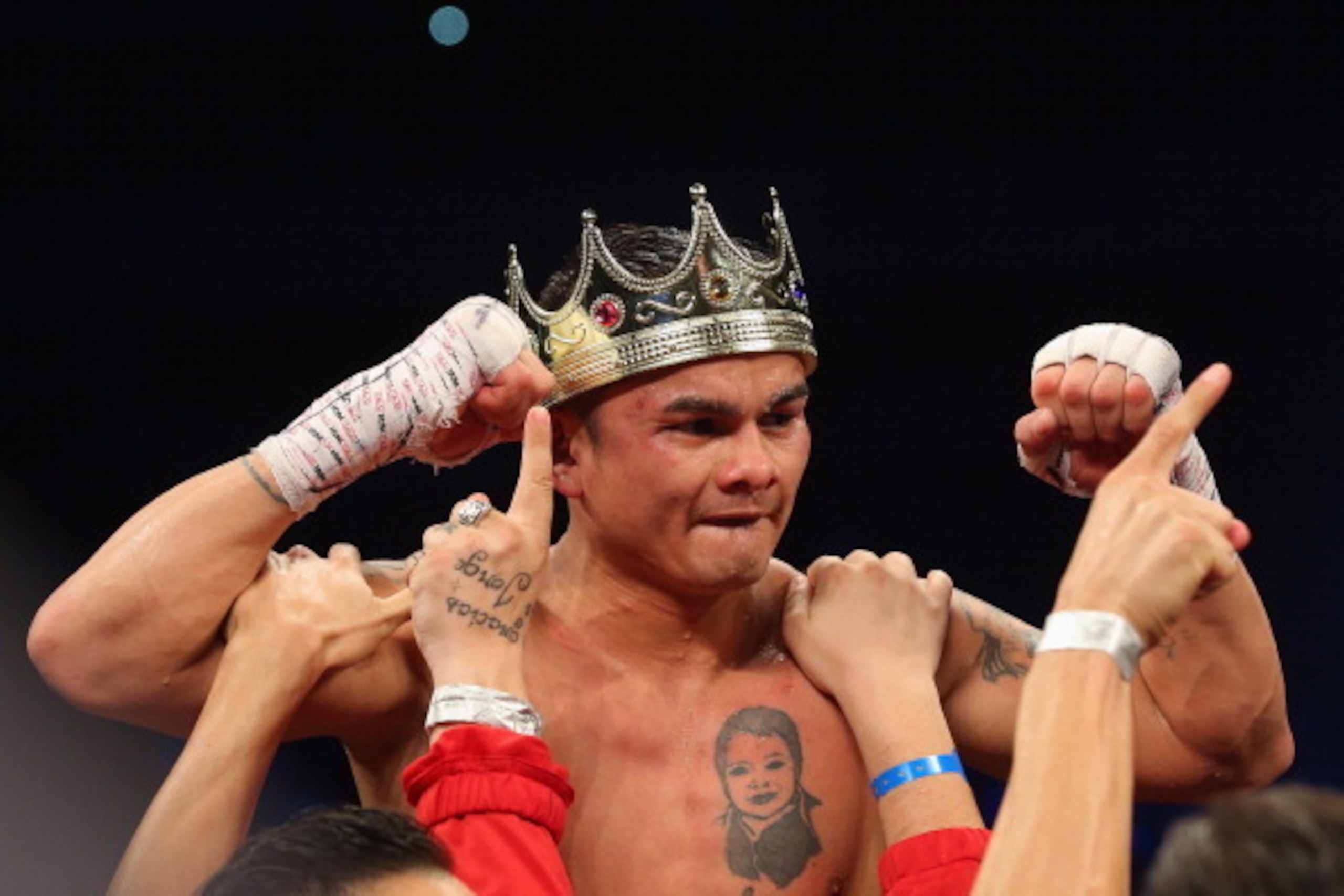 SAN ANTONIO, TX - DECEMBER 14:  Marcos Maidana celebrates his unanimous decision against Adrien Broner becoming the new WBA Welterweight Title champion at Alamodome on December14, 2013 in San Antonio, Texas.during their bout at Alamodome on December 14, 2