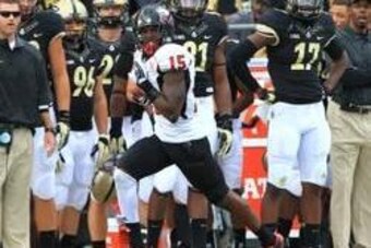 Sep 28, 2013; West Lafayette, IN, USA; Northern Illinois Huskies safety Jimmie Ward (15) returns an interception for a touchdown against the Purdue Boilermakers at Ross Ade Stadium. Northern Illinois won 55-24. Mandatory Credit: Pat Lovell-USA TODAY Sport