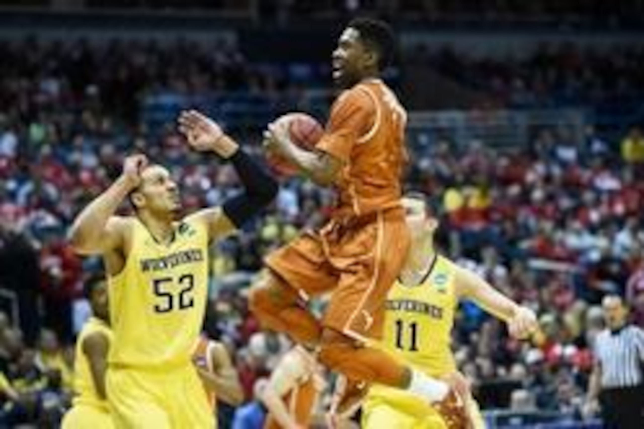 Mar 22, 2014; Milwaukee, WI, USA; Texas Longhorns guard Isaiah Taylor (1) drives to the basket in the first half of a men's college basketball game against the Michigan Wolverines during the third round of the 2014 NCAA Tournament at BMO Harris Bradley Ce