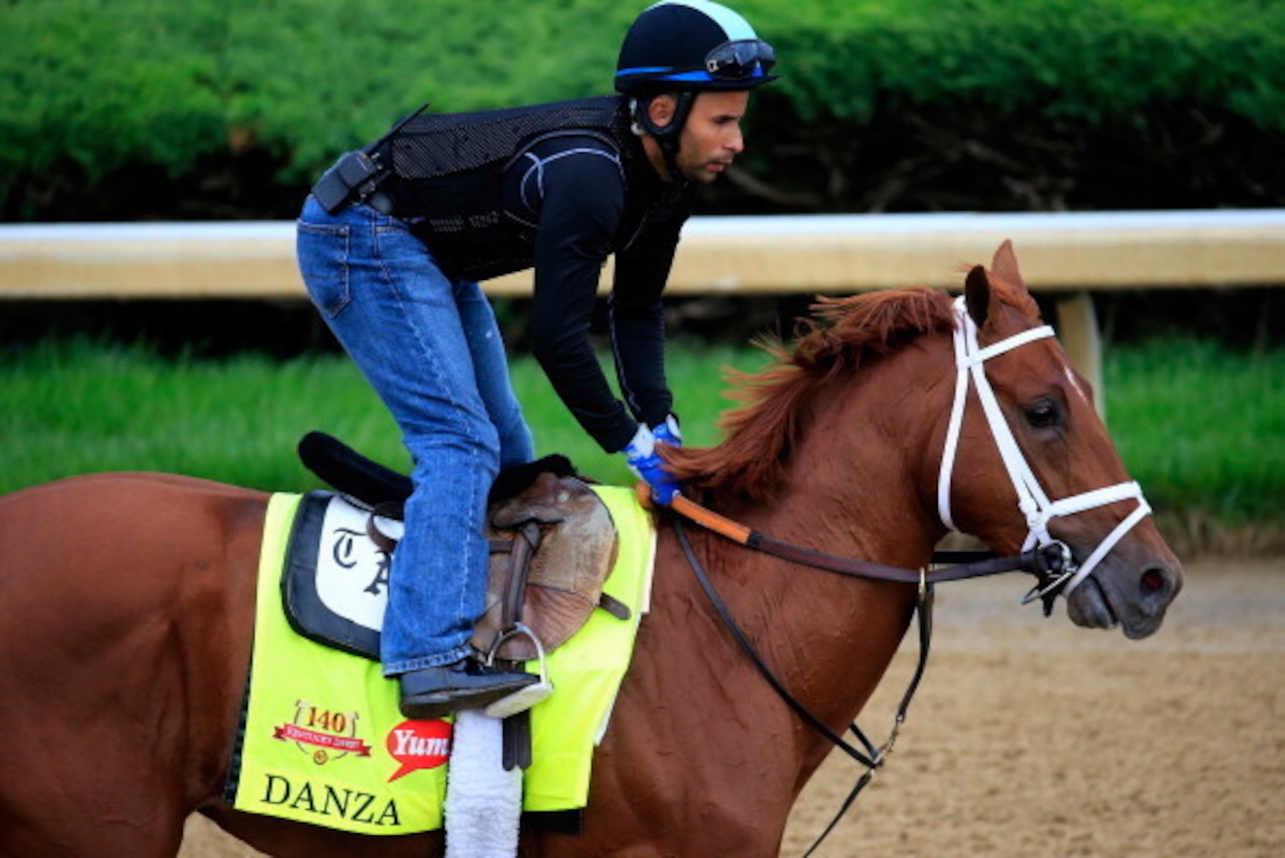 LOUISVILLE, KY - APRIL 30:  Danza ridden by Ezequiel Perez goes over the track during the morning exercise session in preparation for the 140th Kentucky Derby at Churchill Downs on April 30, 2014 in Louisville, Kentucky.  (Photo by Rob Carr/Getty Images)