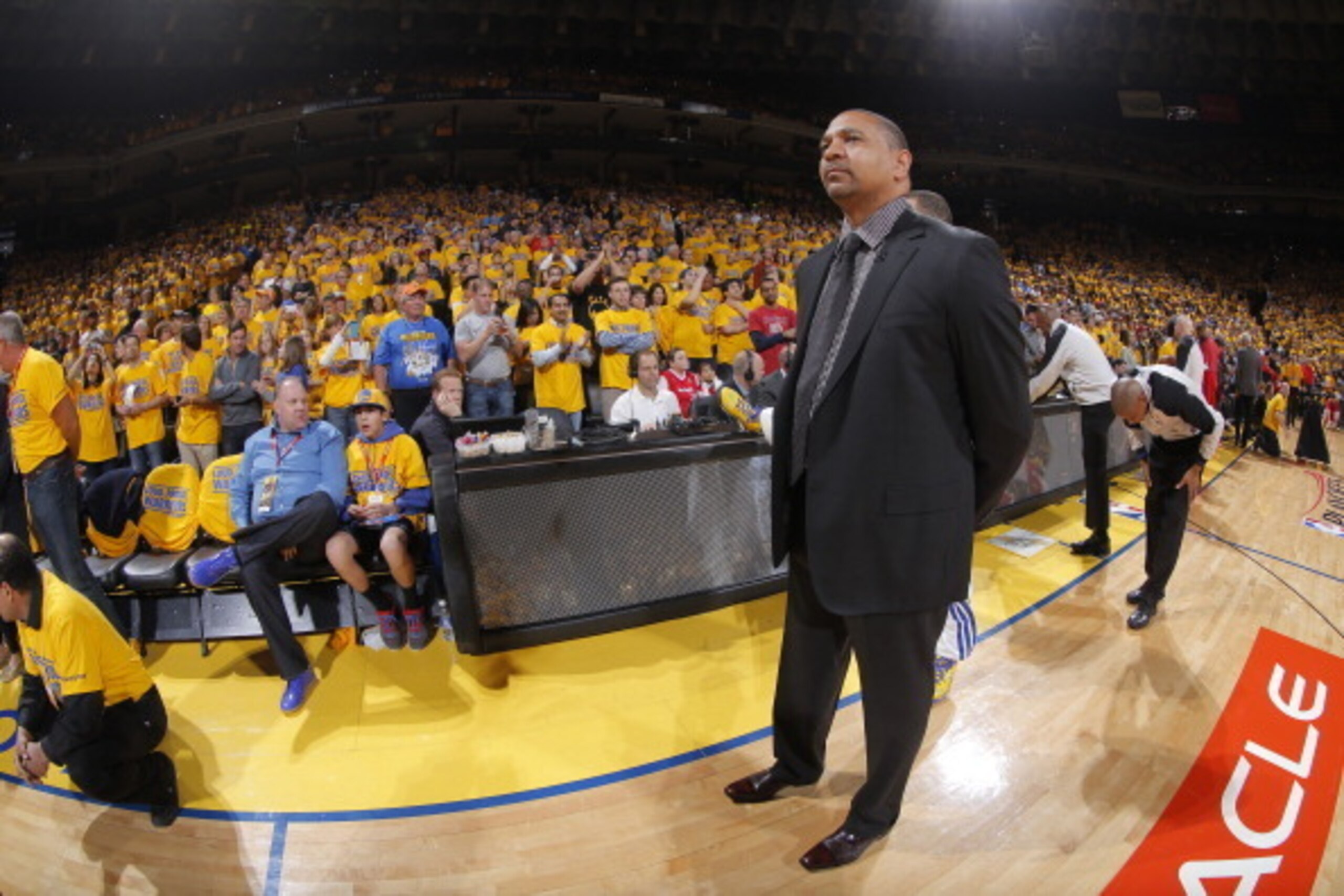 OAKLAND, CA - APRIL 27: Head coach Mark Jackson of the Golden State Warriors watches his team warm up before facing the Los Angeles Clippers in Game Four of the Western Conference Quarterfinals during the 2014 NBA Playoffs at Oracle Arena on April 27, 201