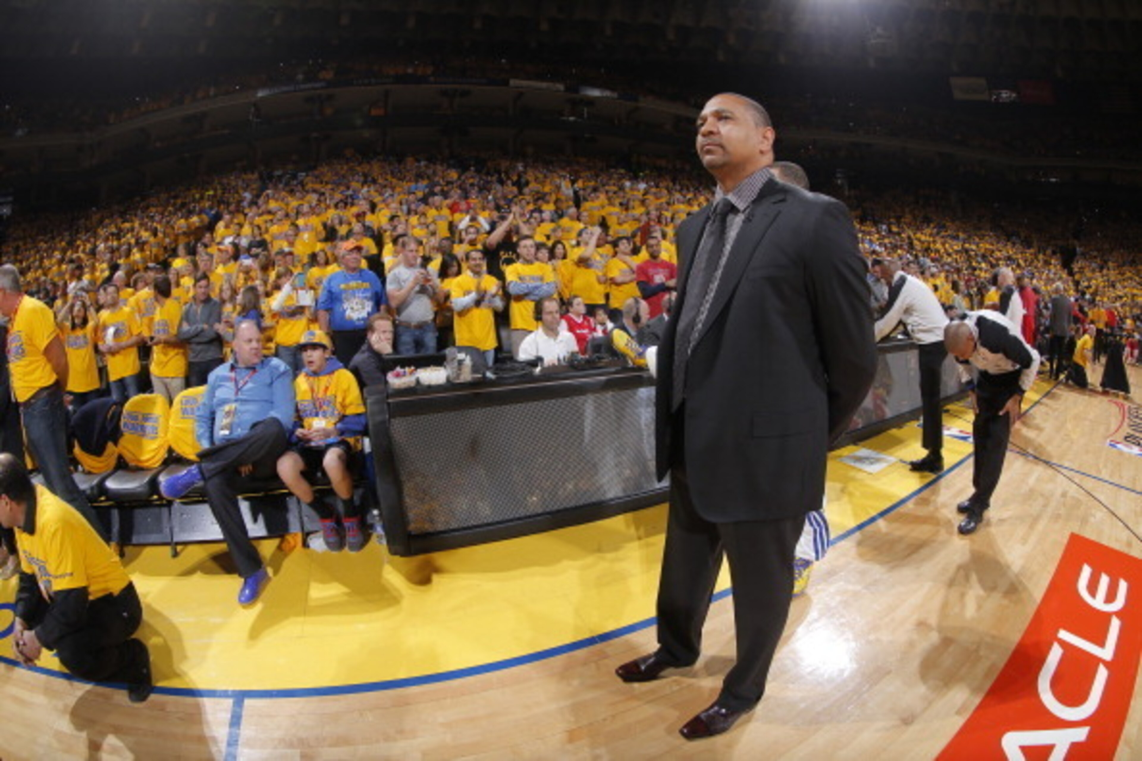 OAKLAND, CA - APRIL 27: Head coach Mark Jackson of the Golden State Warriors watches his team warm up before facing the Los Angeles Clippers in Game Four of the Western Conference Quarterfinals during the 2014 NBA Playoffs at Oracle Arena on April 27, 201