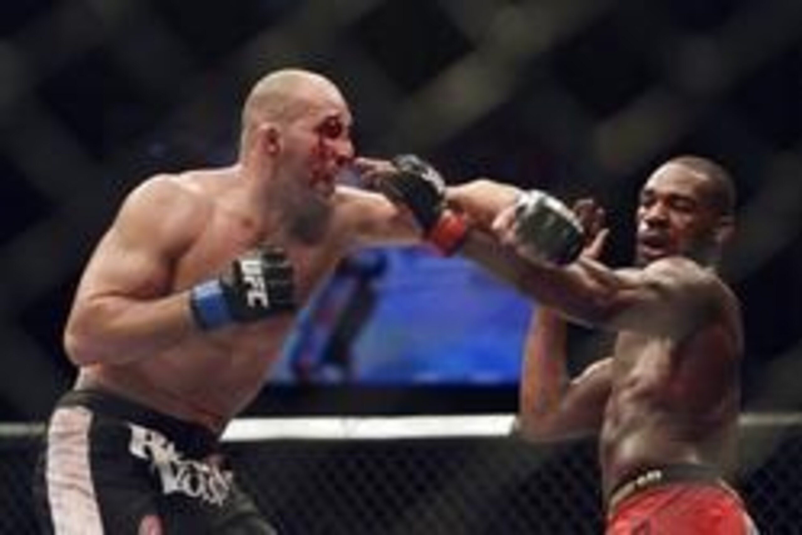 Apr 26, 2014; Baltimore, MD, USA;  Jon Jones and Glover Teixeira exchange punches during the UFC light heavy weight championship fight at  Baltimore Arena. Jones retained the light heavy height championship by defeating  Teixeria.  Mandatory Credit: Tommy