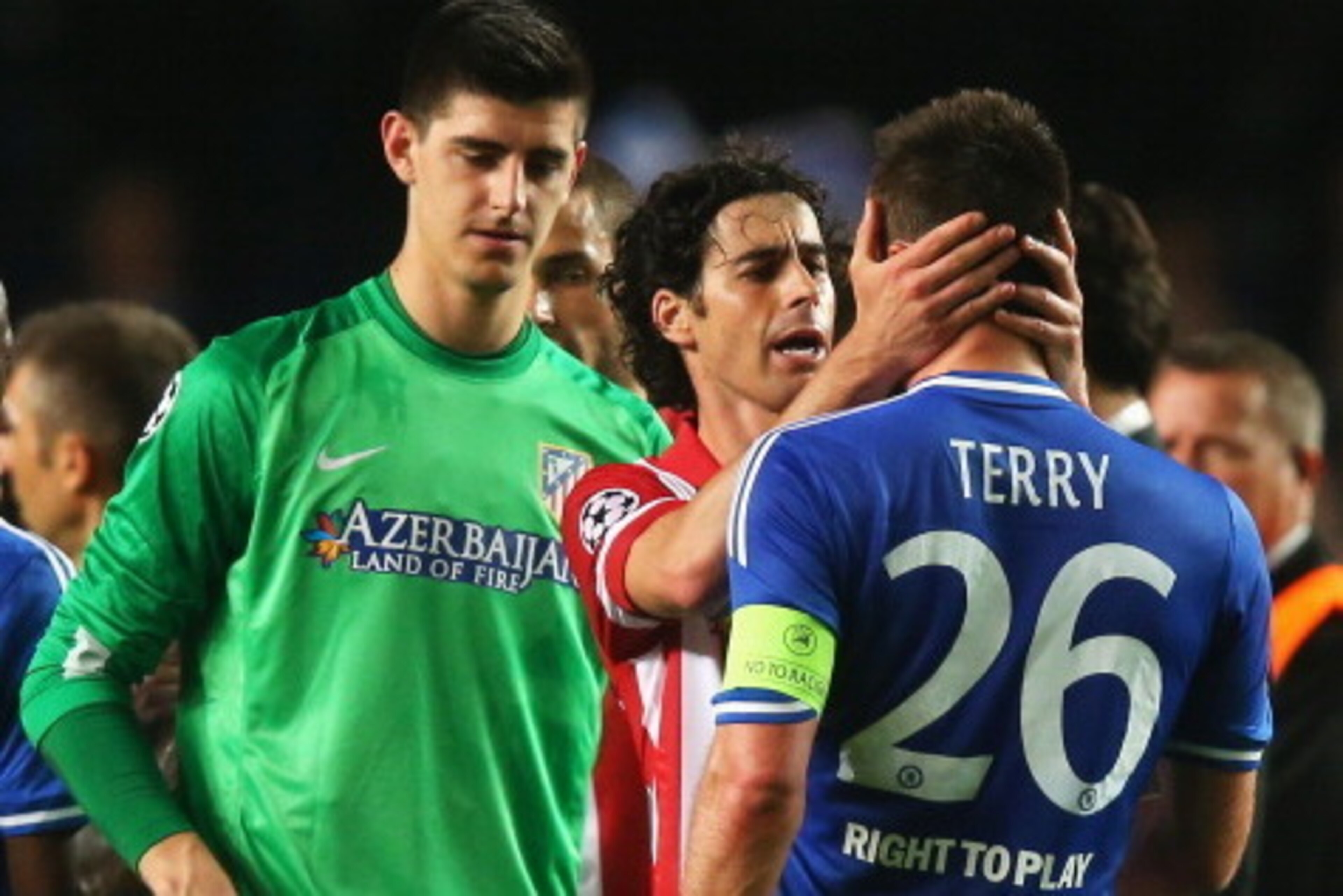 LONDON, ENGLAND - APRIL 30: Tiago of Club Atletico de Madrid consoles John Terry of Chelsea as Thibaut Courtois (L) looks on after the UEFA Champions League semi-final second leg match between Chelsea and Club Atletico de Madrid at Stamford Bridge on Apri