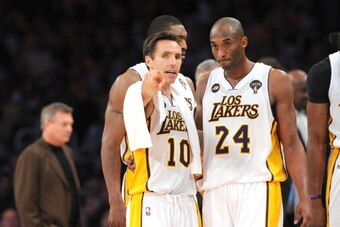 LOS ANGELES, CA - MARCH 10: Steve Nash #10 of the Los Angeles Lakers confers with teammate Kobe Bryant #24 in their game against the Chicago Bulls at Staples Center on March 10, 2013 in Los Angeles, California. NOTE TO USER: User expressly acknowledges an