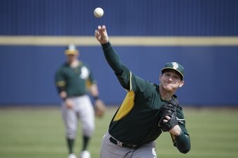 Projected Opening Day starter Jarrod Parker won't be doing this for Oakland in 2014 after undergoing Tommy John surgery.