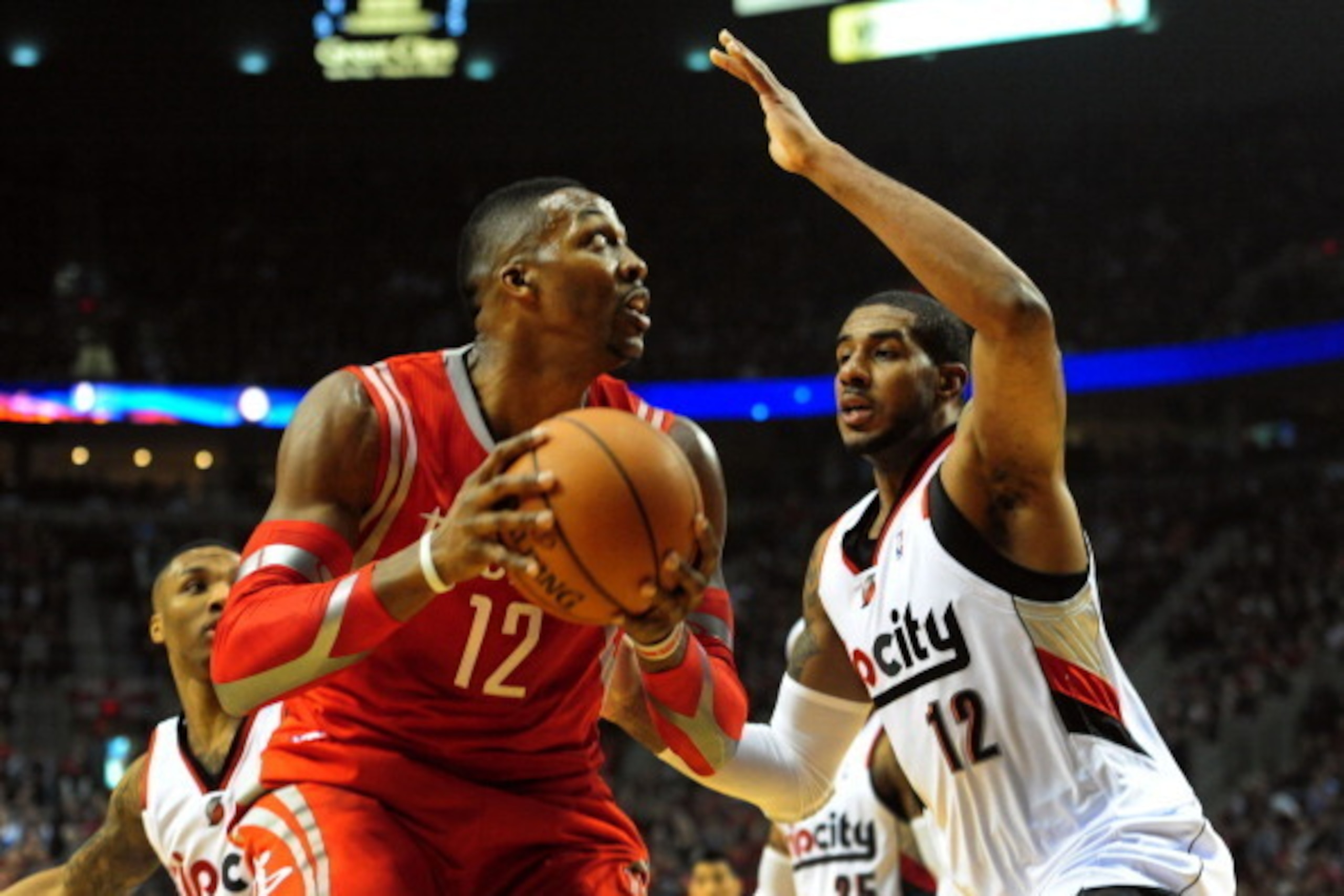 PORTLAND, OR - APRIL 25: Dwight Howard #12 of the Houston Rockets goes up for a shot over LaMarcus Aldridge #12 of the Portland Trail Blazers during the first quarter in Game Three of the Western Conference Quarterfinals during the 2014 NBA Playoffs at th
