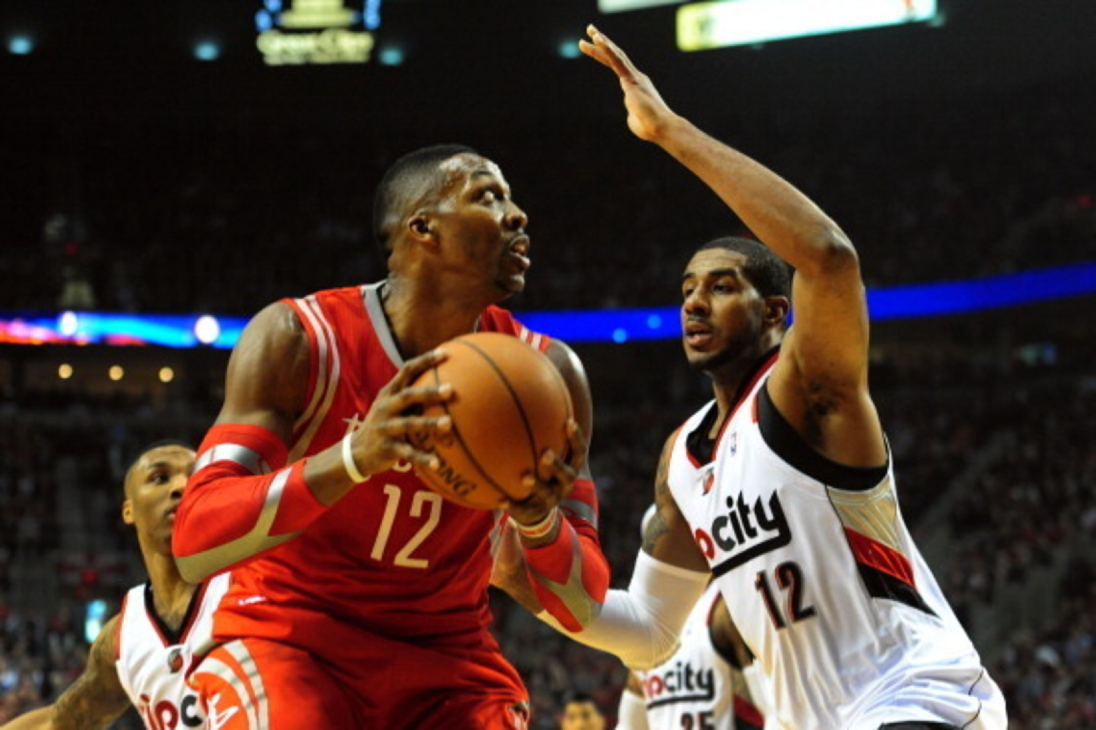 PORTLAND, OR - APRIL 25: Dwight Howard #12 of the Houston Rockets goes up for a shot over LaMarcus Aldridge #12 of the Portland Trail Blazers during the first quarter in Game Three of the Western Conference Quarterfinals during the 2014 NBA Playoffs at th