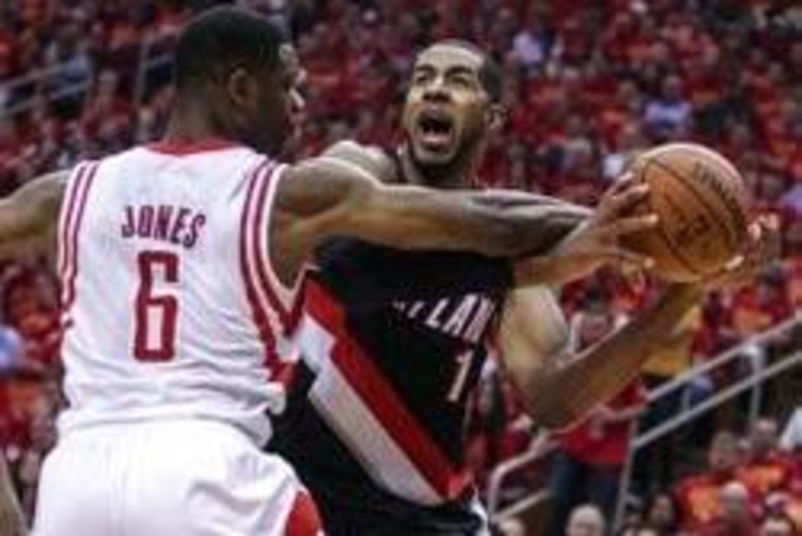 Apr 30, 2014; Houston, TX, USA; Houston Rockets forward Terrence Jones (6) is called for a foul during the second quarter as Portland Trail Blazers forward LaMarcus Aldridge (12) attempts to drive the ball to the basket in game five of the first round of 