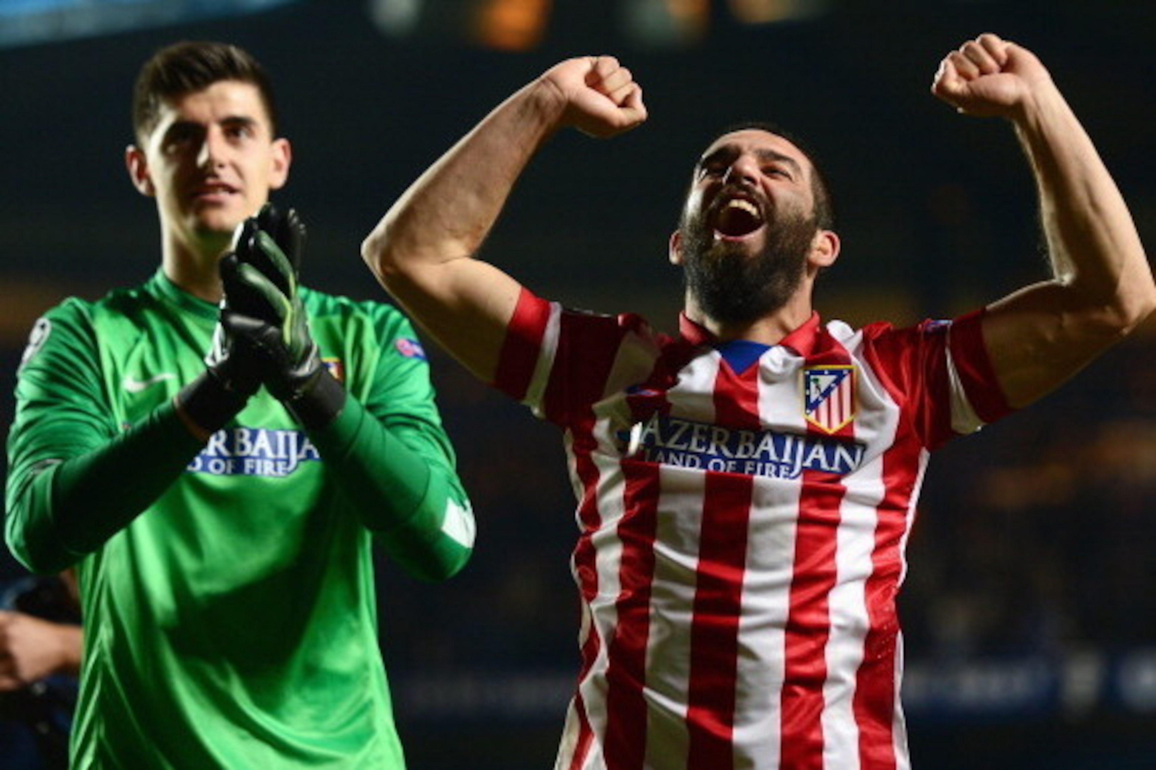 LONDON, ENGLAND - APRIL 30: Arda Turan (R) and Thibaut Courtois of Club Atletico de Madrid celebrate victory after the UEFA Champions League semi-final second leg match between Chelsea and Club Atletico de Madrid at Stamford Bridge on April 30, 2014 in Lo