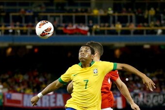 TORONTO, ON - NOVEMBER 19:  Robinho#7 of Brazil  and Carlos Carmona #6 of Chile vie for the ball during a friendly match at Rogers Centre on November 19, 2013 in Toronto, Canada.Brazil defeated Chile 2-1.  (Photo by Elsa/Getty Images)