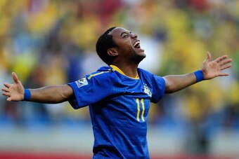 PORT ELIZABETH, SOUTH AFRICA - JULY 02:  Robinho of Brazil celebrates scoring the opening goal during the 2010 FIFA World Cup South Africa Quarter Final match between Netherlands and Brazil at Nelson Mandela Bay Stadium on July 2, 2010 in Nelson Mandela B