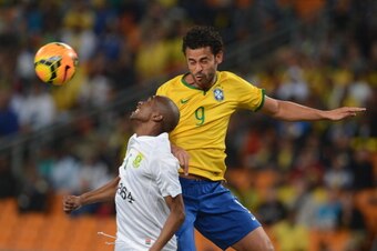 JOHANNESBURG, SOUTH AFRICA - MARCH 05: Anele Ngcongca of South Africa and Fred of Brazil during the International Friendly match between South Africa and Brazil at FNB Stadium on March 05, 2014 in Johannesburg, South Africa. (Photo by Lefty Shivambu/Gallo