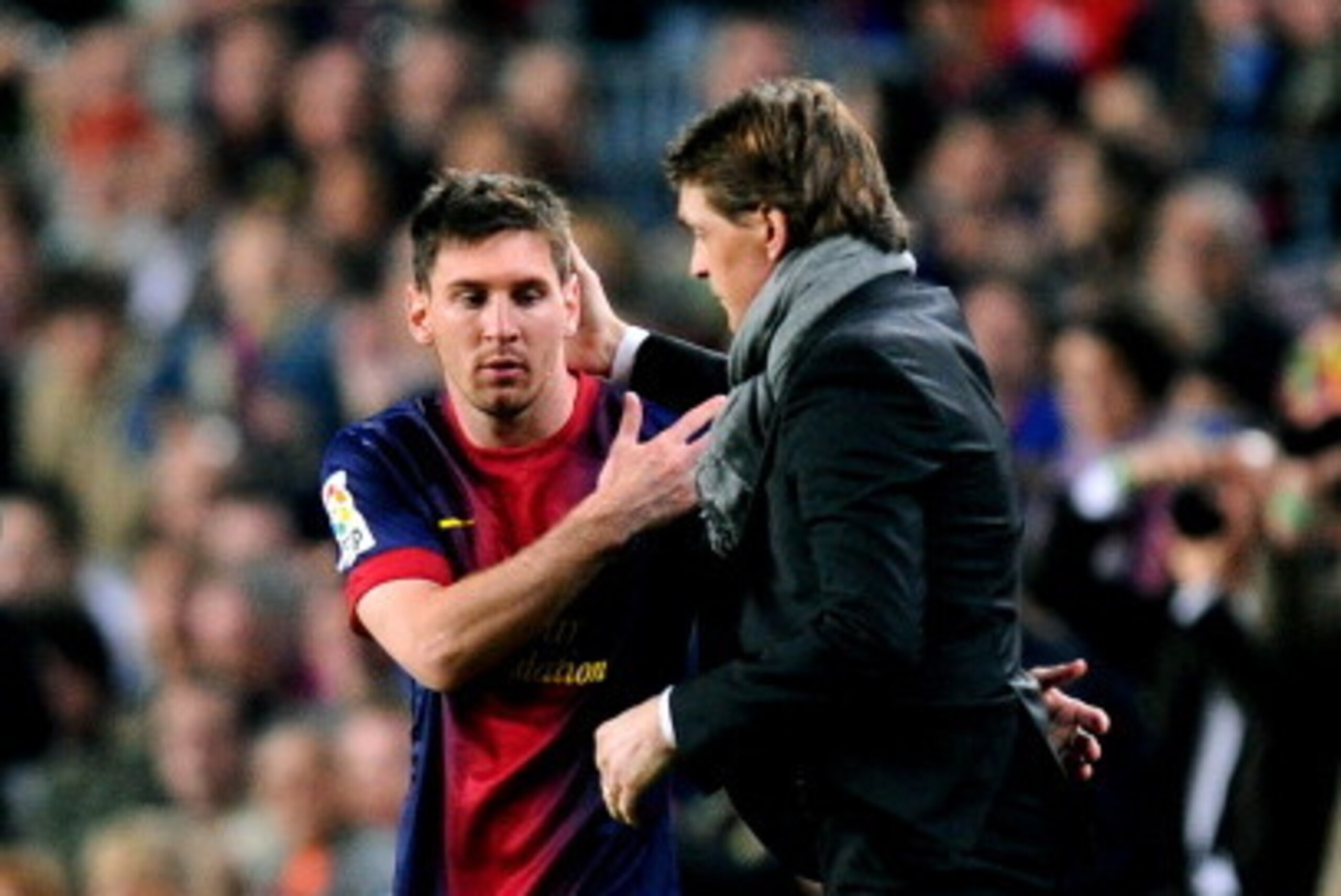 BARCELONA, SPAIN - MAY 05:  Lionel Messi of Barcelona speaks with Tito Vilanova the Barcelona head coach as he prepares to come off the bench during the La Liga match between FC Barcelona and Real Betis Balompie at Camp Nou on May 5, 2013 in Barcelona, Sp