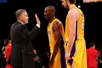 LOS ANGELES, CA - NOVEMBER 20:  Head coach Mike D'Antoni of the Los Angeles Lakers celebrates with Kkobe Bryant #24 and Pau Gasol #16 after the game against the Brooklyn Nets at Staples Center on November 20, 2012 in Los Angeles, California. The Lakers wo