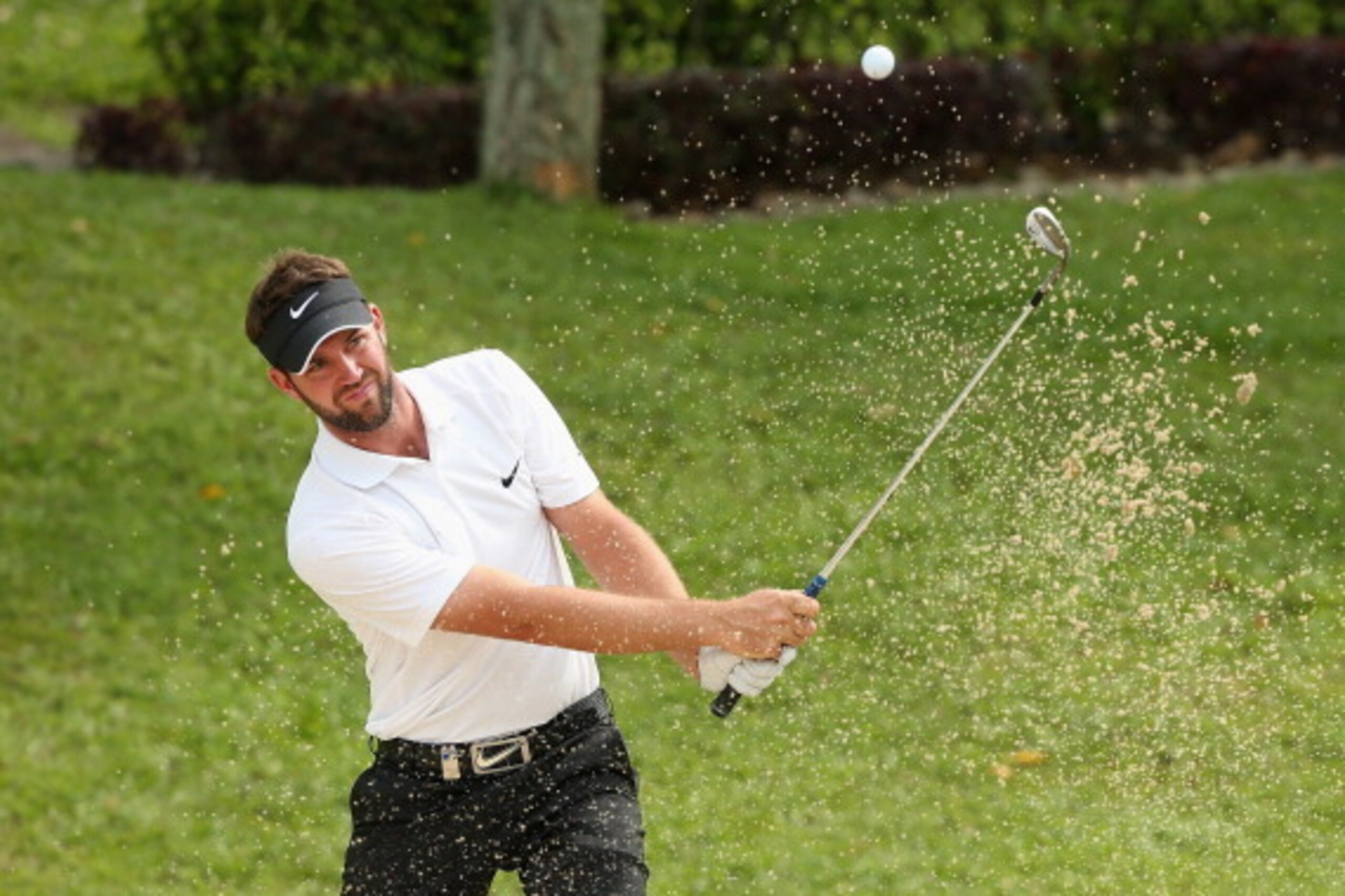 SINGAPORE - MAY 01:  Scott Jamieson of Scotland plays a bunker shot on the 17th hole on day one of The Championship at Laguna National held at Laguna National Golf & Country Club on April 30, 2014 in Singapore.  (Photo by Andrew Redington/Getty Images)