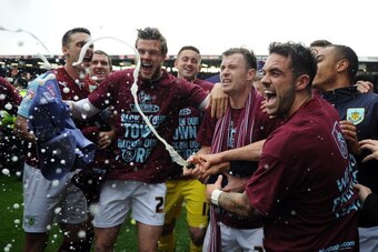 BURNLEY, ENGLAND - APRIL 21: Burnley celebrate following the Sky Bet Championship match between Burnley and Wigan Athletic at Turf Moor on April 21, 2014 in Burnley, England. (Photo by Chris Brunskill/Getty Images)