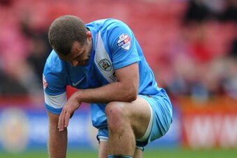 MIDDLESBROUGH, ENGLAND - APRIL 26: Stephen Dawson of Barnsley looks dejected during the Sky Bet Championship match between Middlesbrough and Barnsley at the Riverside Stadium on April 26, 2014 in Middlesbrough, England. (Photo by Chris Brunskill/Getty Ima