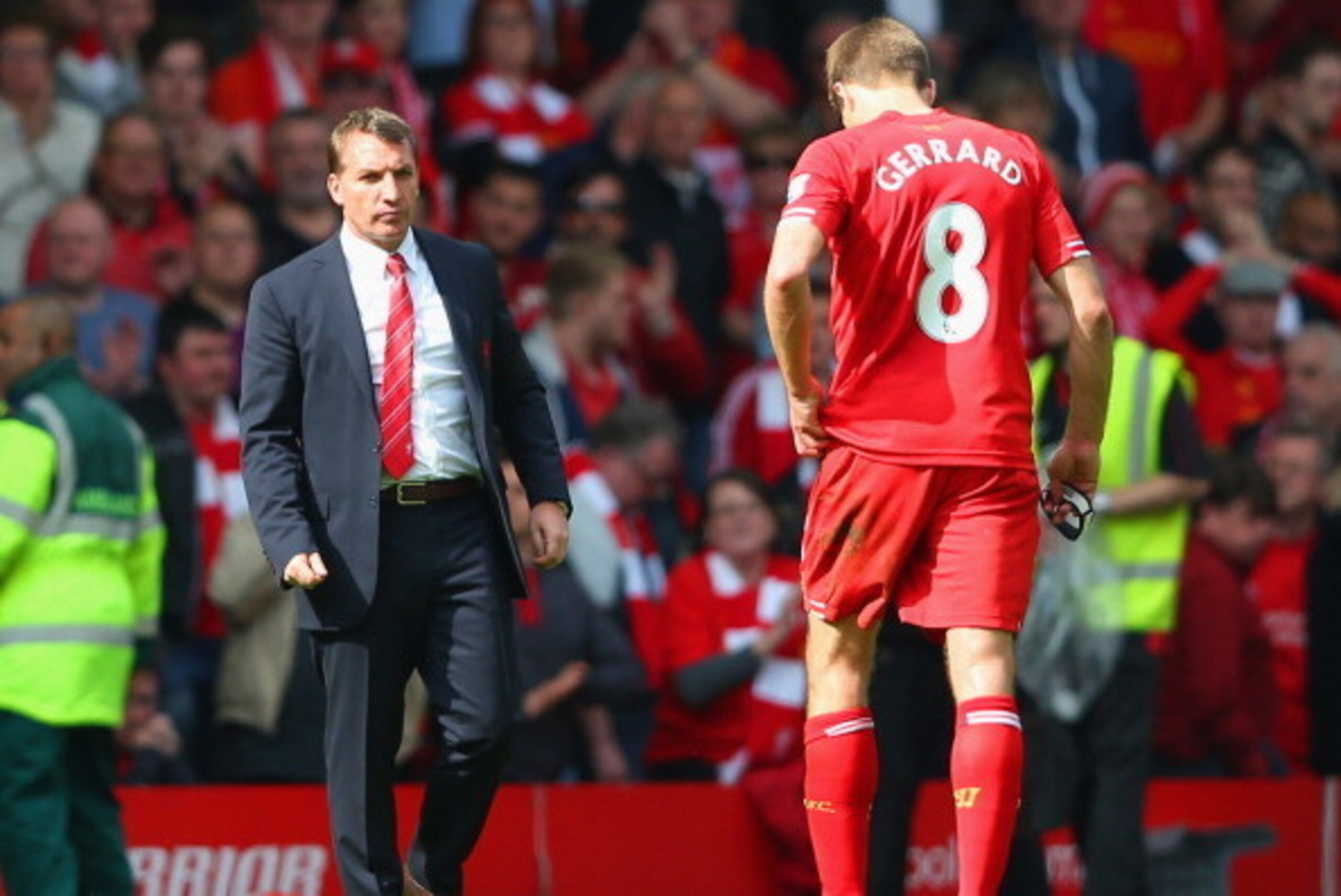 LIVERPOOL, ENGLAND - APRIL 27:  Manager Brendan Rodgers of Liverpool looks to a dejected Steven Gerrard of Liverpool at the end of the match during the Barclays Premier League match between Liverpool and Chelsea at Anfield on April 27, 2014 in Liverpool, 