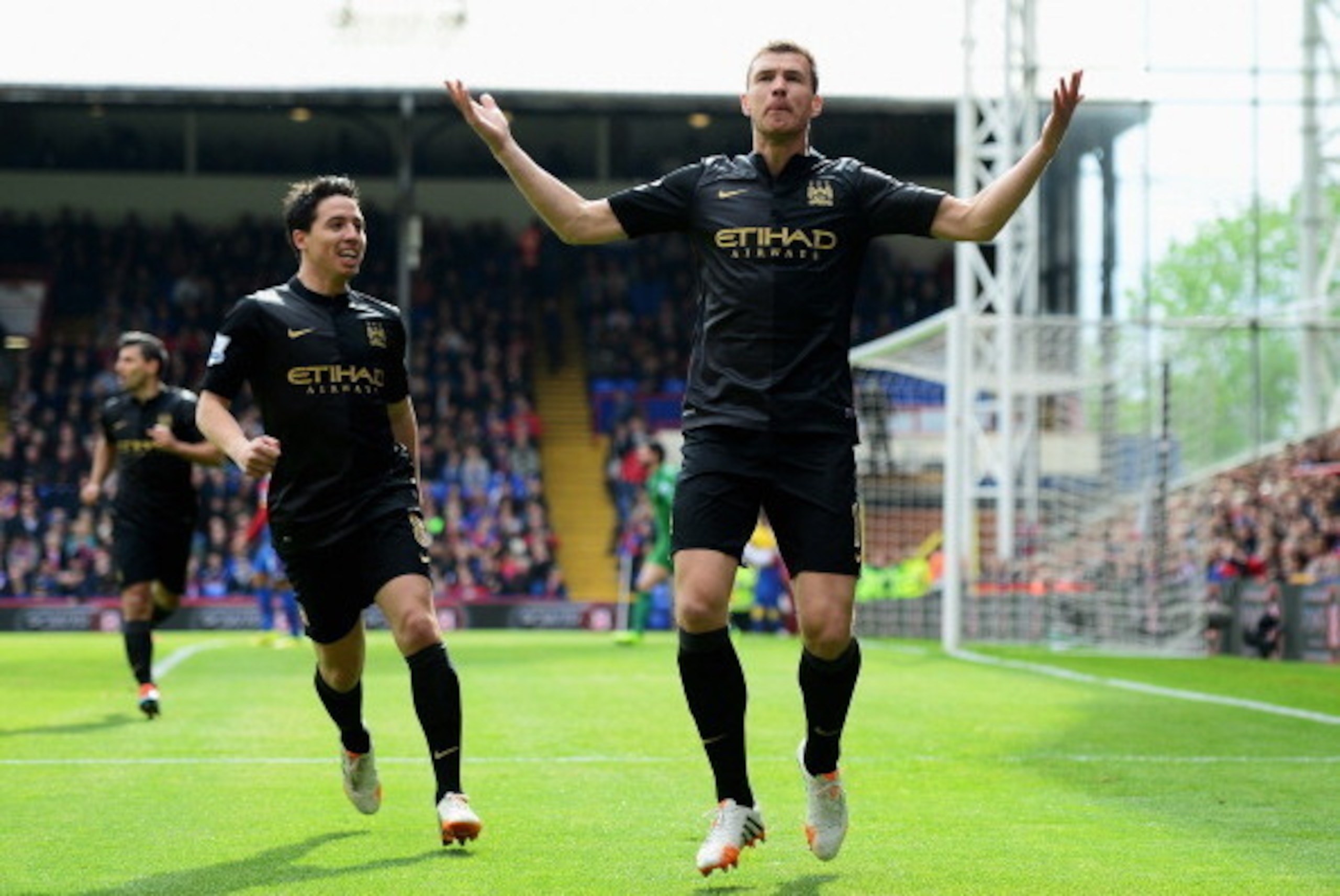 LONDON, ENGLAND - APRIL 27:  Edin Dzeko of Manchester City celebrates scoring the opening goal with Samir Nasri of Manchester City during the Barclays Premier League match between Crystal Palace and Manchester City at Selhurst Park on April 27, 2014 in Lo