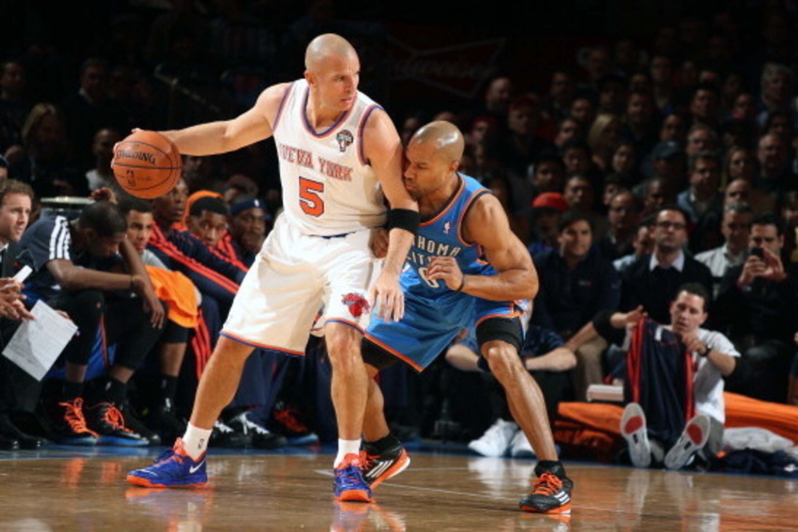 NEW YORK, NY - MARCH  7: Jason Kidd #5 of the New York Knicks controls the ball against Derek Fisher #6 of the Oklahoma City Thunder on March 7, 2013 at Madison Square Garden in New York City.  NOTE TO USER: User expressly acknowledges and agrees that, by