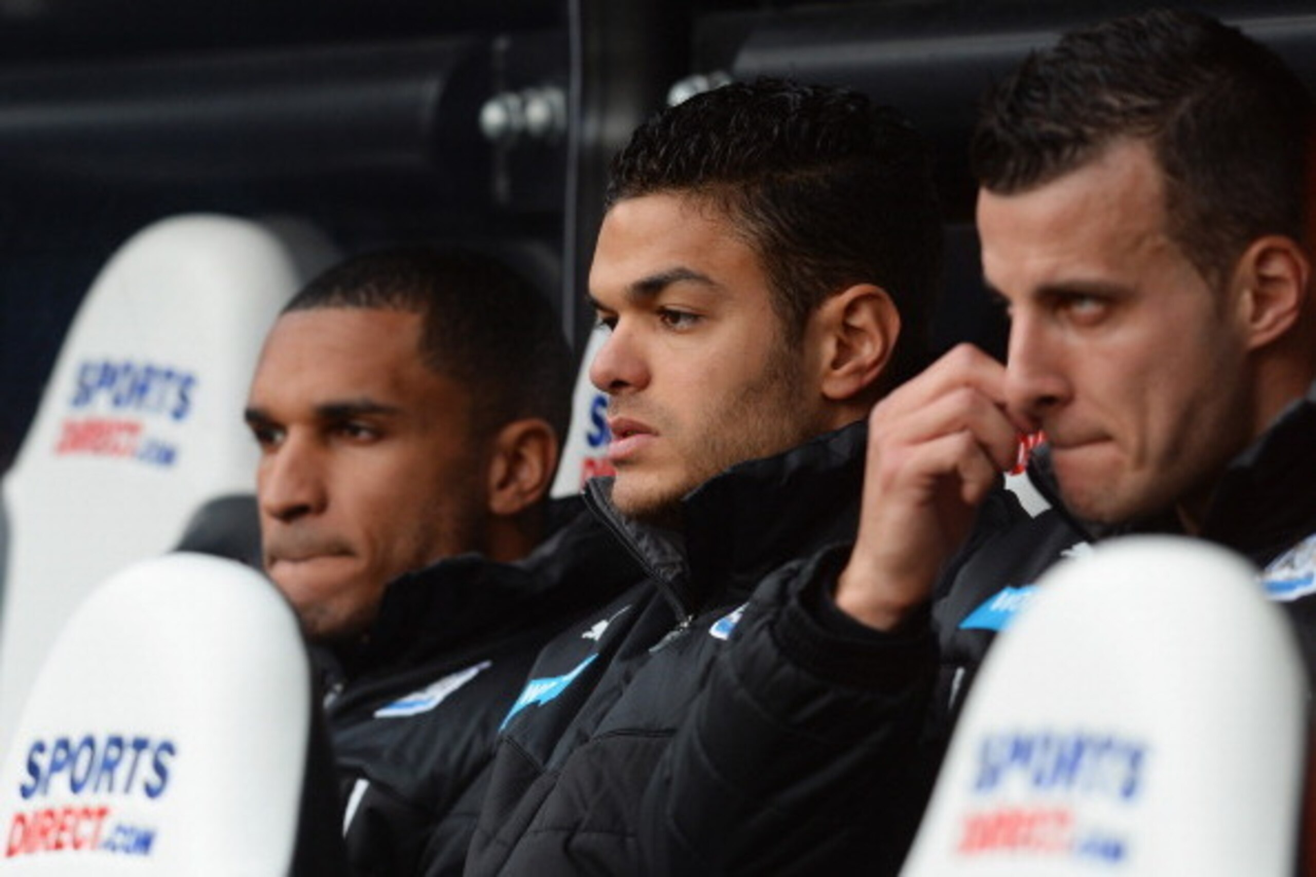 NEWCASTLE UPON TYNE, ENGLAND - MARCH 22:  Hatem Ben Arfa (C) of Newcastle United looks on from the bench during the Barclays Premier League match between Newcastle United and Crystal Palace at St James' Park on March 22, 2014 in Newcastle upon Tyne, Engla