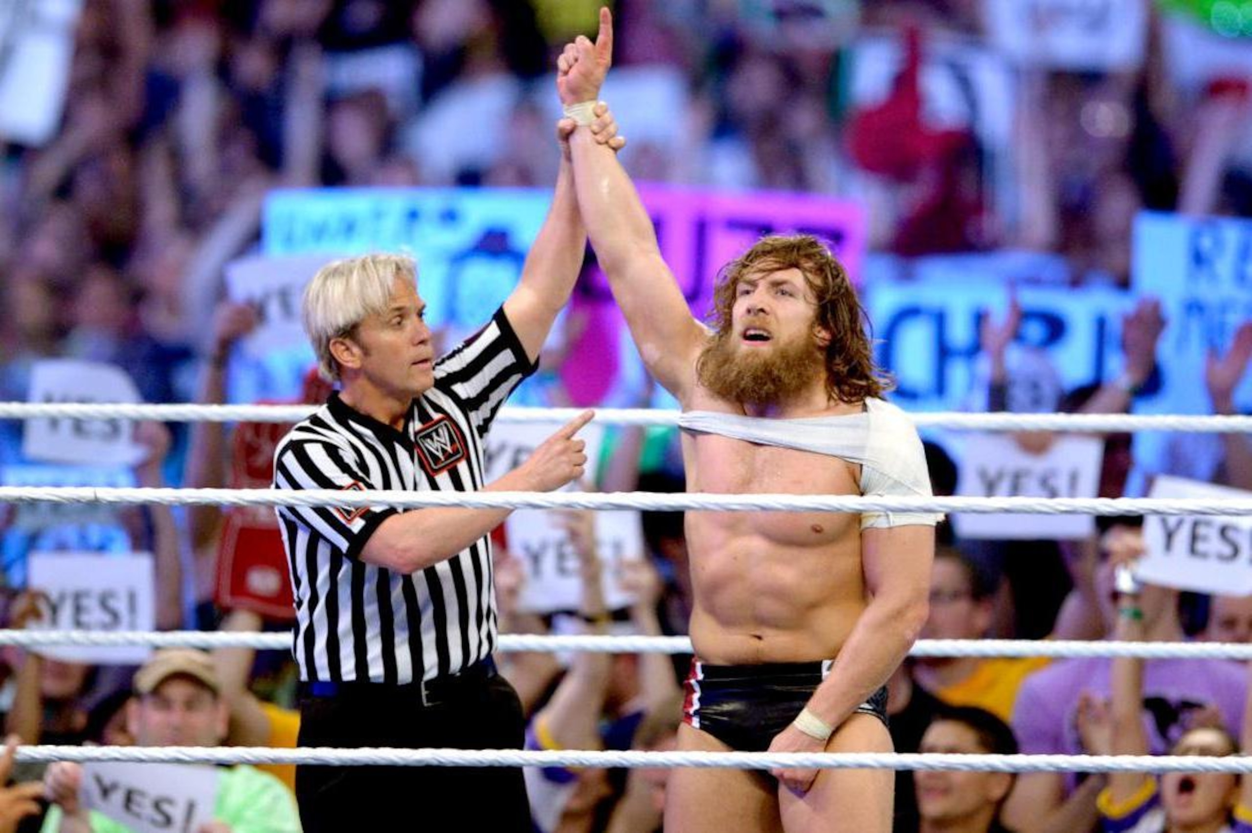 Daniel Bryan celebrates defeating Triple H at WrestleMania 30.