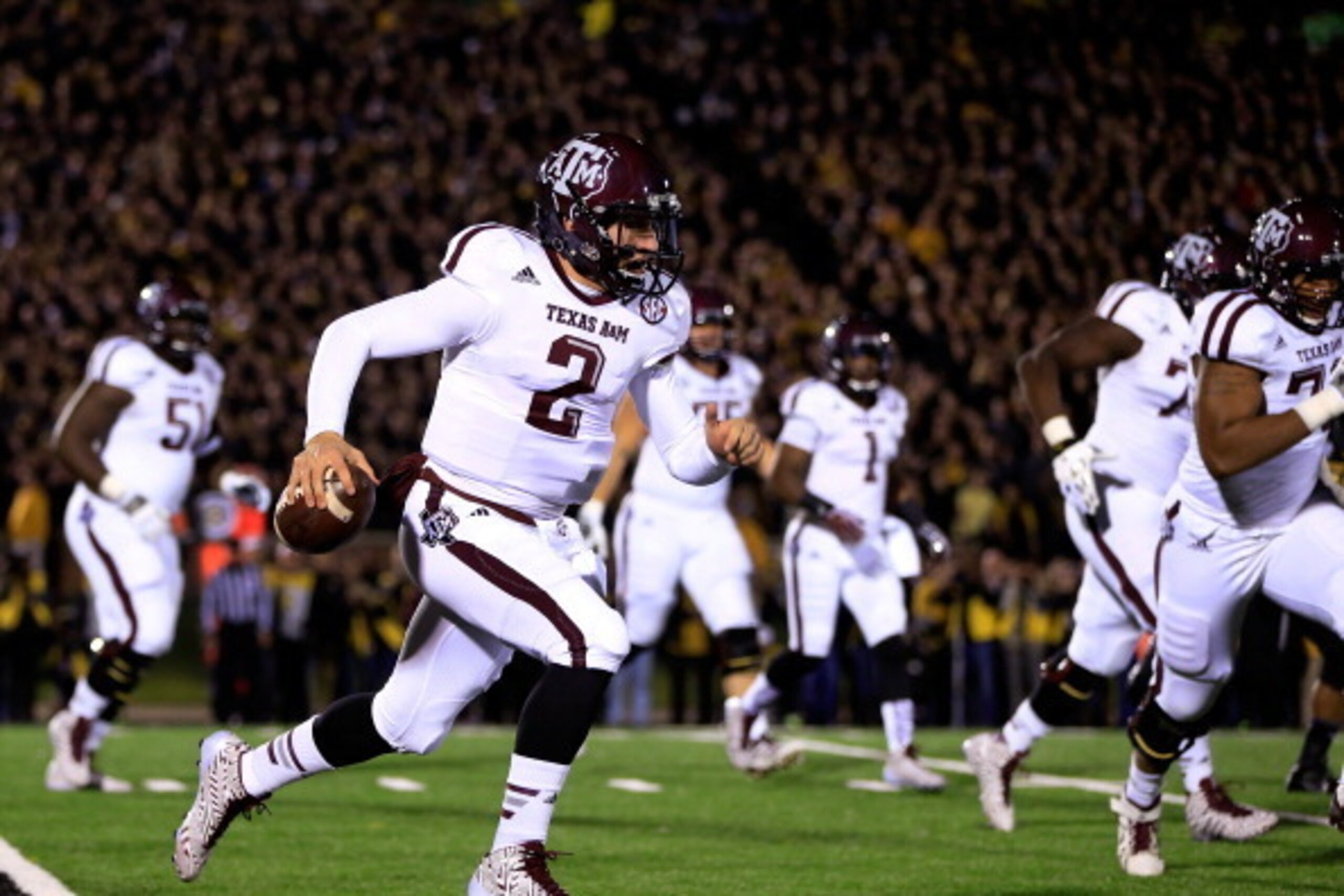 COLUMBIA, MO - NOVEMBER 30:  Quarterback Johnny Manziel #2 of the Texas A&M Aggies scrambles during the game against the Missouri Tigers on November 30, 2013 in Columbia, Missouri.  (Photo by Jamie Squire/Getty Images)