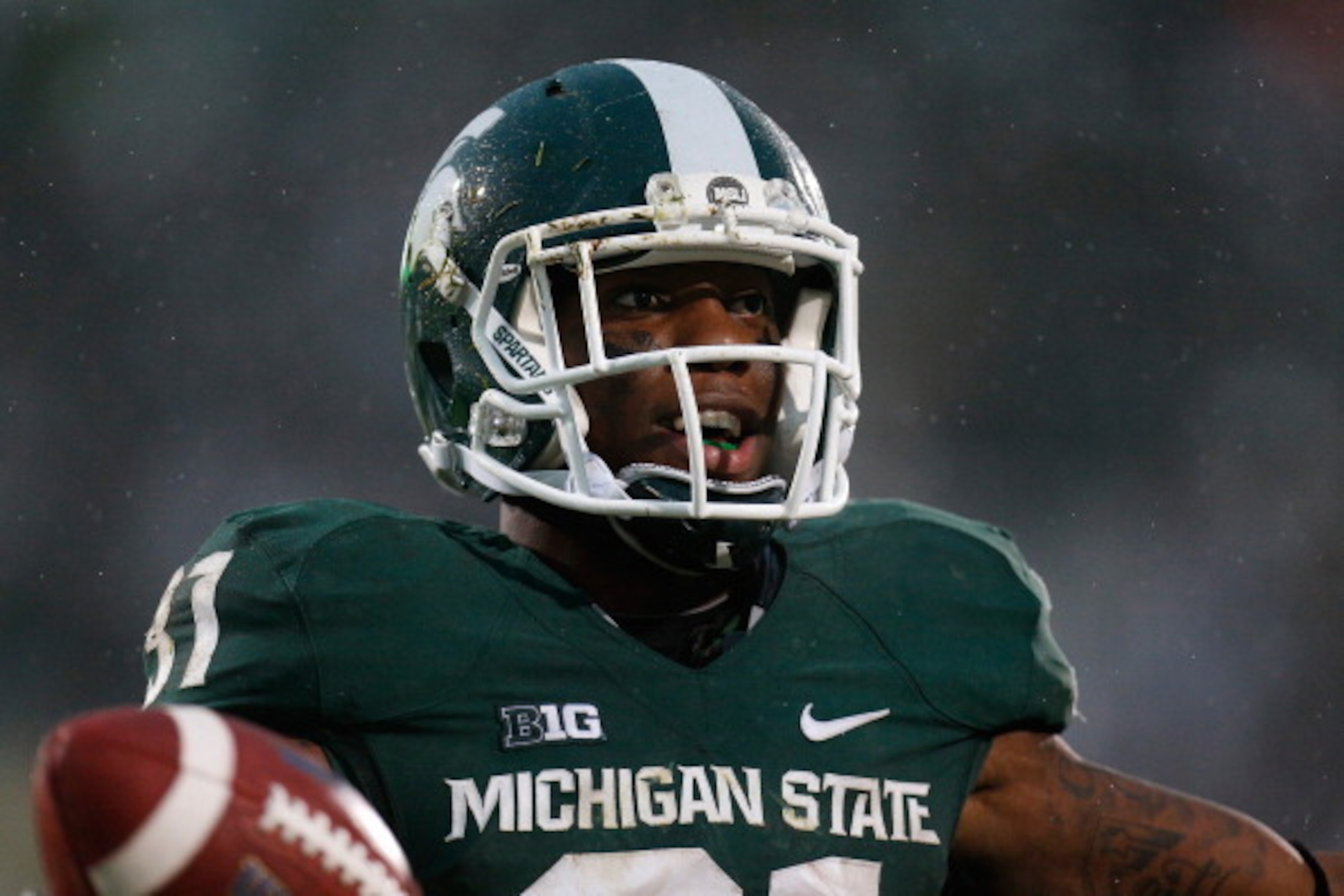 EAST LANSING, MI - NOVEMBER 02: Darqueze Dennard #31 of the Michigan State Spartans celebrates a win over the Michigan Wolverines  at Spartan Stadium on November 2, 2013 in East Lansing, Michigan. (Photo by Gregory Shamus/Getty Images)