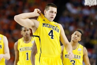 ATLANTA, GA - APRIL 06:  Mitch McGary #4 of the Michigan Wolverines reacts in the first half against the Syracuse Orange during the 2013 NCAA Men's Final Four Semifinal at the Georgia Dome on April 6, 2013 in Atlanta, Georgia.  (Photo by Kevin C. Cox/Gett