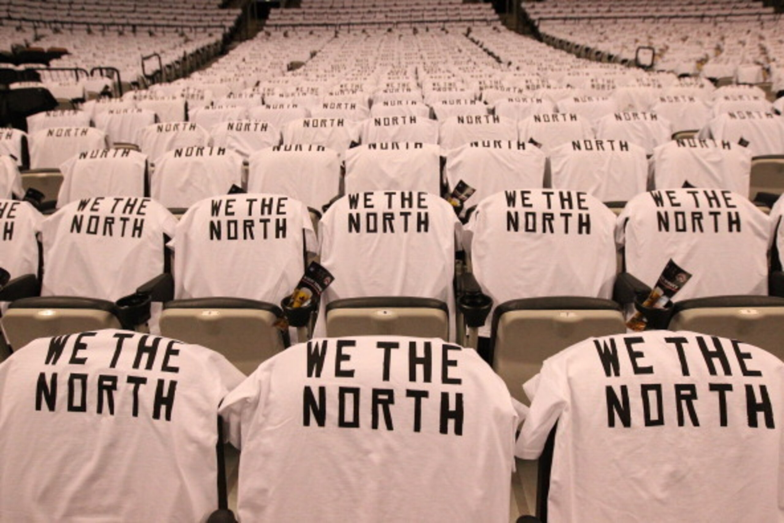 TORONTO,ON - APRIL 30: T-shirts hang on fans seats before Game Five of the Eastern Conference Quarterfinals between the Brooklyn Nets and the Toronto Raptors during the 2014 NBA Playoffs at the Air Canada Centre on April 30, 2014 in Toronto, Ontario, Cana