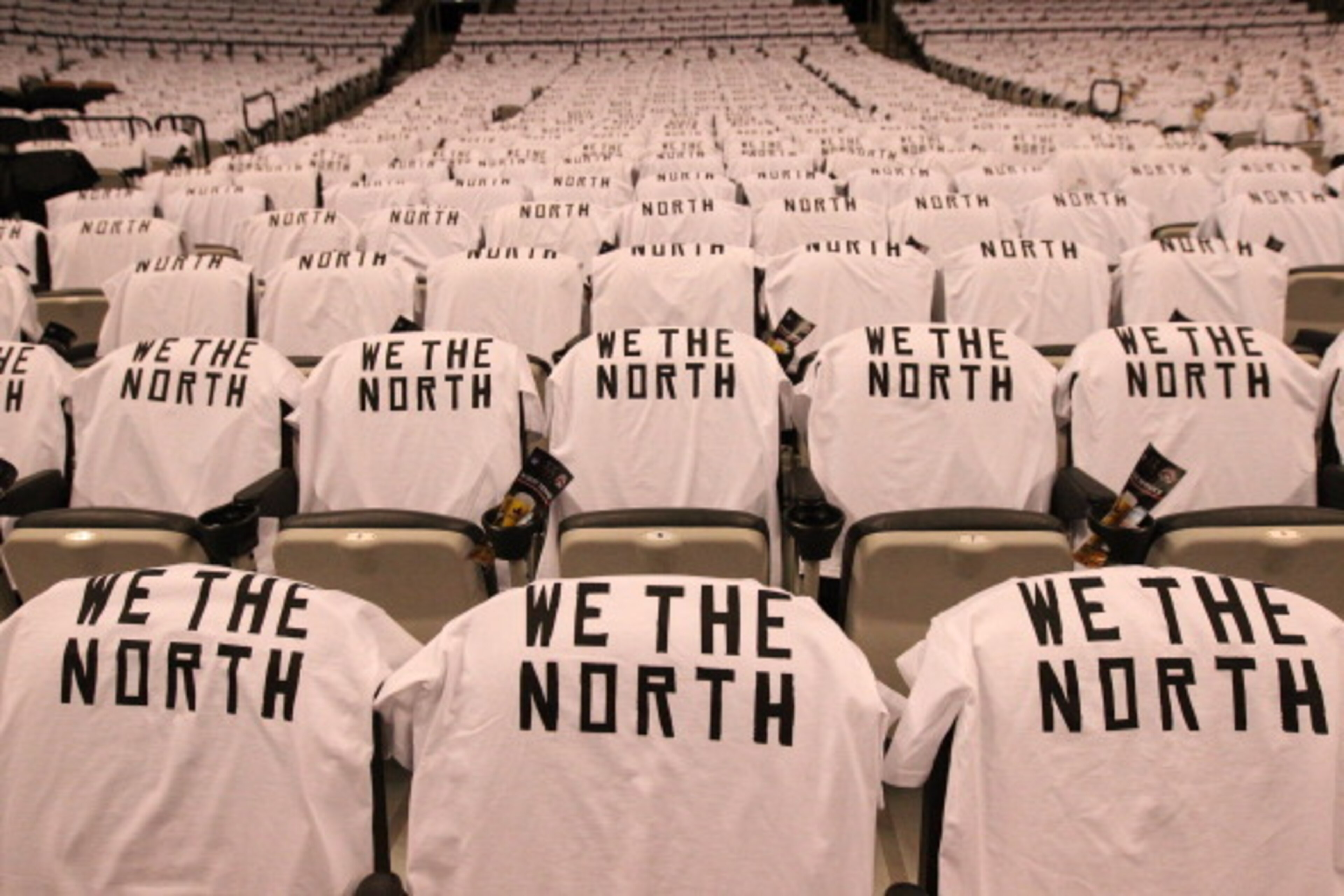 TORONTO,ON - APRIL 30: T-shirts hang on fans seats before Game Five of the Eastern Conference Quarterfinals between the Brooklyn Nets and the Toronto Raptors during the 2014 NBA Playoffs at the Air Canada Centre on April 30, 2014 in Toronto, Ontario, Cana