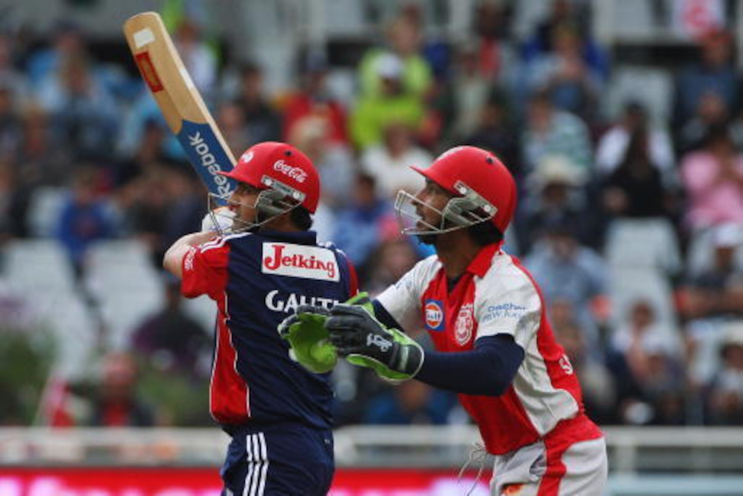 CAPE TOWN, SOUTH AFRICA - APRIL 19:  Gautam Gambhir of Delhi hits out past Kumar Sangakarra of Kings XI during the  IPL T20 match between Delhi Daredevils and Kings XI Punjab on April 19, 2009 in Cape Town, South Africa.  (Photo by Tom Shaw/Getty Images)