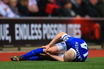 SOUTHAMPTON, ENGLAND - APRIL 26:  Steven Naismith of Everton lies injured after clashing with Dejan Lovren of Southampton (not pictured) during the Barclays Premier League match between Southampton and Everton at St Mary's Stadium on April 26, 2014 in Sou
