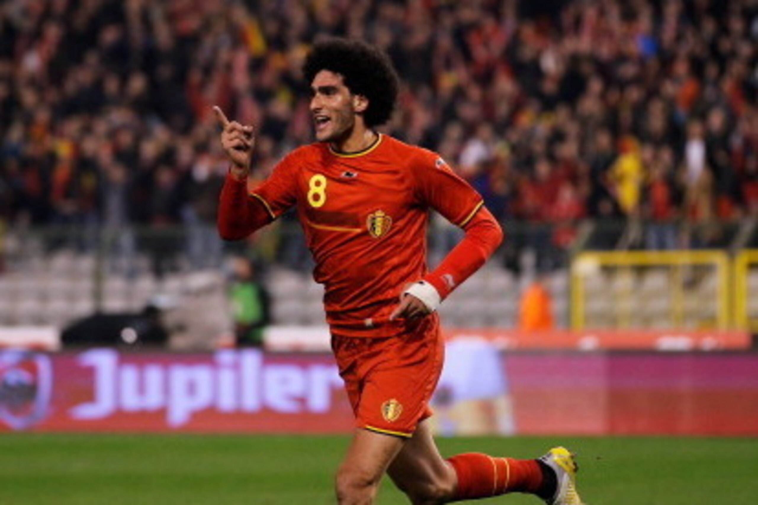 BRUSSELS, BELGIUM - MARCH 05:  Marouane Fellaini #8 of Belgium celebrates after he scores the first goal of the game during the International Friendly match between Belgium and Ivory Coast at The King Baudouin Stadium on March 5, 2014 in Brussels, Belgium
