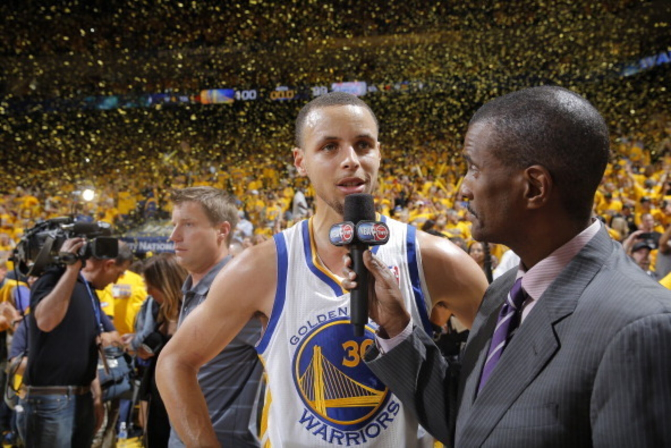 OAKLAND, CA - MAY 1: Stephen Curry #30 of the Golden State Warriors is interviewed by commentator David Aldridge after defeating the Los Angeles Clippers in Game Six of the Western Conference Quarterfinals during the 2014 NBA Playoffs at Oracle Arena on M