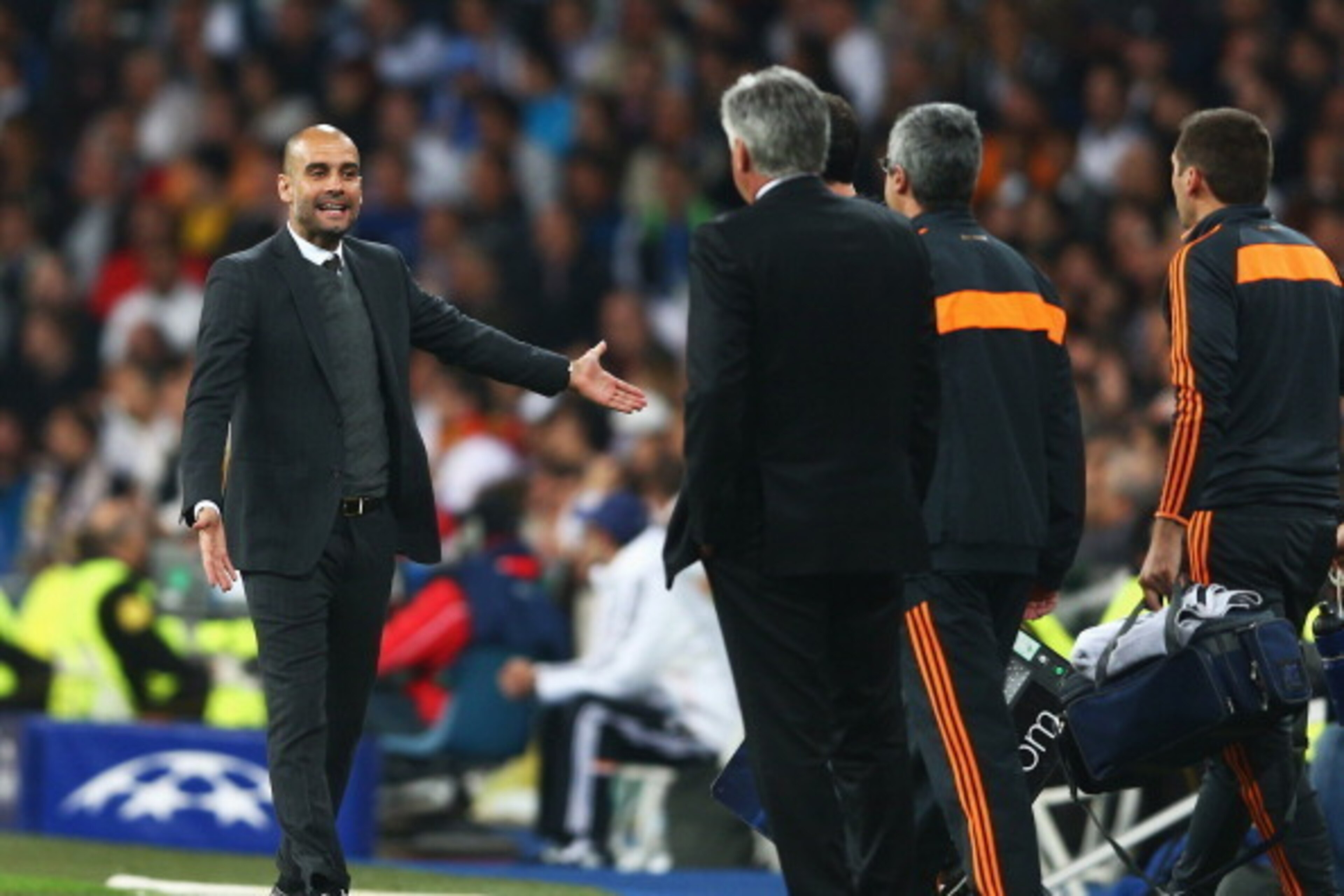 MADRID, SPAIN - APRIL 23: Josep Guardiola, coach of Bayern Muenchen shows his frustration to Carlo Ancelotti, coach of Real Madrid during the UEFA Champions League semi-final first leg match between Real Madrid and FC Bayern Muenchen at the Estadio Santi MADRID, SPAIN - APRIL 23: Josep Guardiola, coach of Bayern Muenchen shows his frustration to Carlo Ancelotti, coach of Real Madrid during the UEFA Champions League semi-final first leg match between Real Madrid and FC Bayern Muenchen at the Estadio Santi