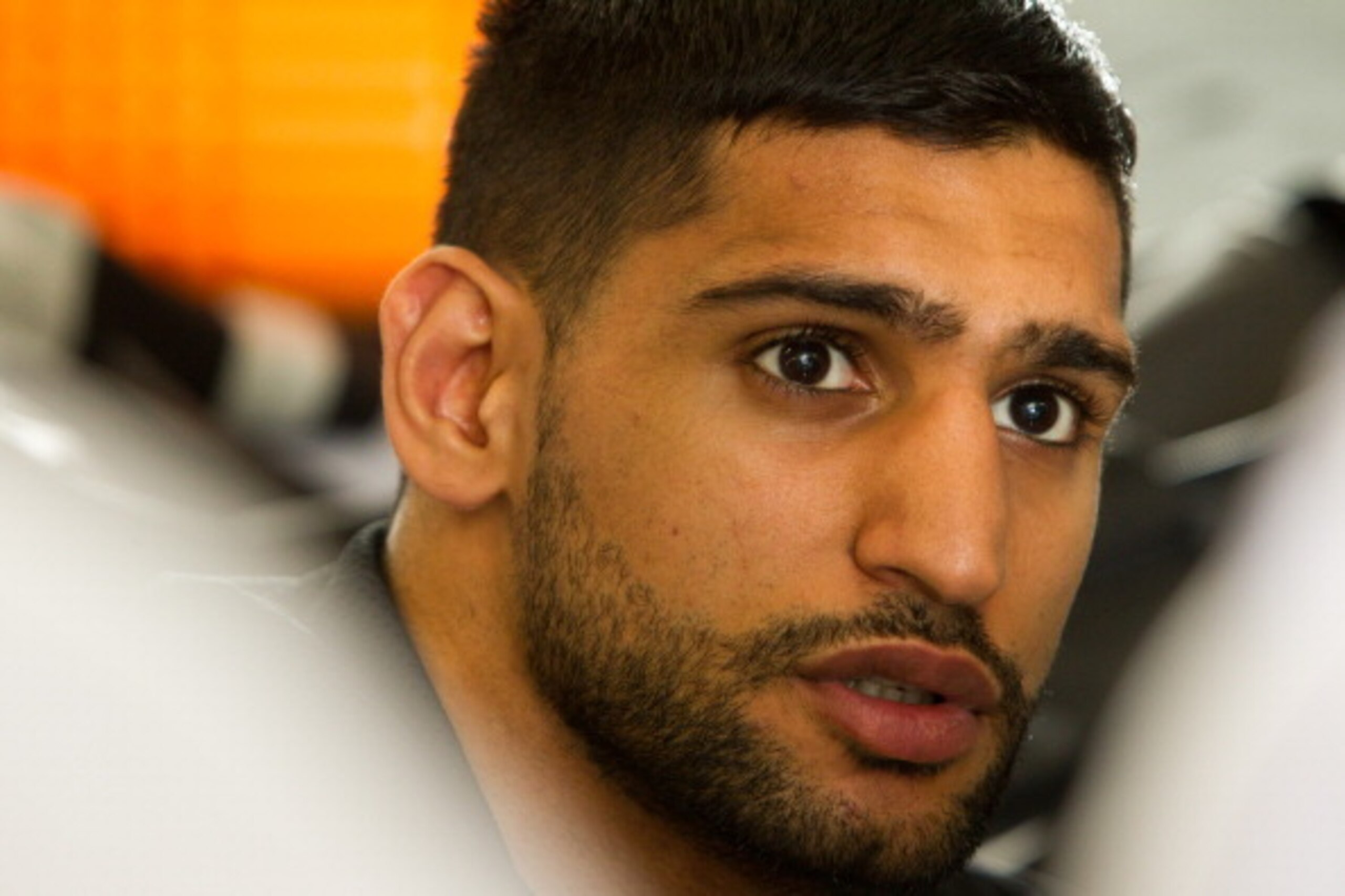HAYWARD, CA - APRIL 24:  Amir Khan looks on as he gets his hands wrapped during a workout session at Virgil Hunter's Gym on April 24, 2014 in Hayward, California. Kahn is preparing to take on Luis Collazo at the MGM Grand in Las Vegas on May 3, 2014. (Pho