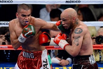 LAS VEGAS, NV - SEPTEMBER 14:  (L-R) Carlos Molina throws a left to the head of Ishe Smith during their IBF junior middleweight title fight at the MGM Grand Garden Arena on September 14, 2013 in Las Vegas, Nevada.  (Photo by Ethan Miller/Getty Images)