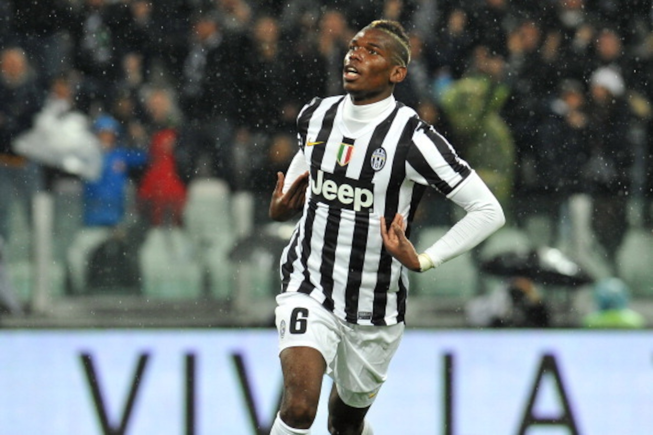 TURIN, ITALY - APRIL 19:  Paul Pogba of Juventus celebrates after scoring the opening goal during the Serie A match between Juventus and Bologna FC at Juventus Arena on April 19, 2014 in Turin, Italy.  (Photo by Valerio Pennicino/Getty Images)
