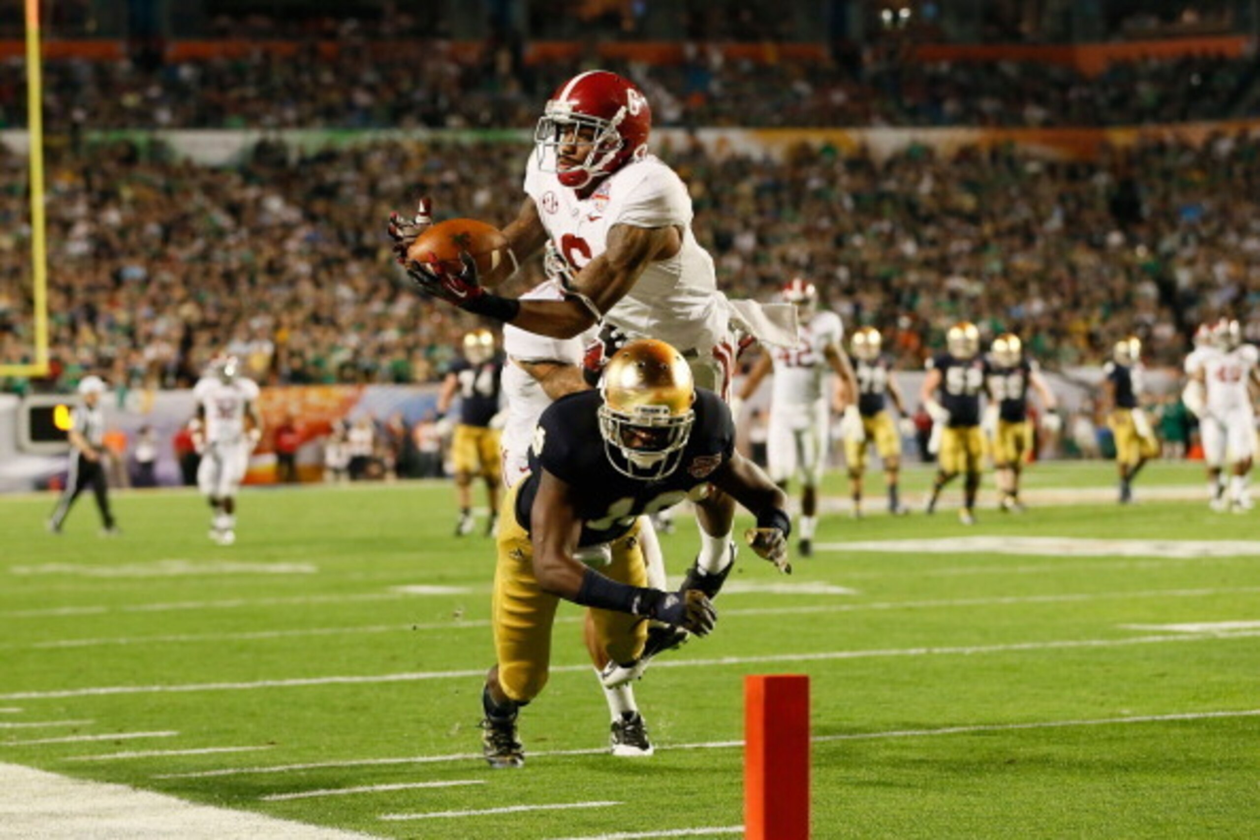MIAMI GARDENS, FL - JANUARY 07:  Ha'Sean Clinton-Dix #6 of the Alabama Crimson Tide intercepts a pass intended for DaVaris Daniels #10 of the Notre Dame Fighting Irish in the third quarter of the 2013 Discover BCS National Championship game at Sun Life St