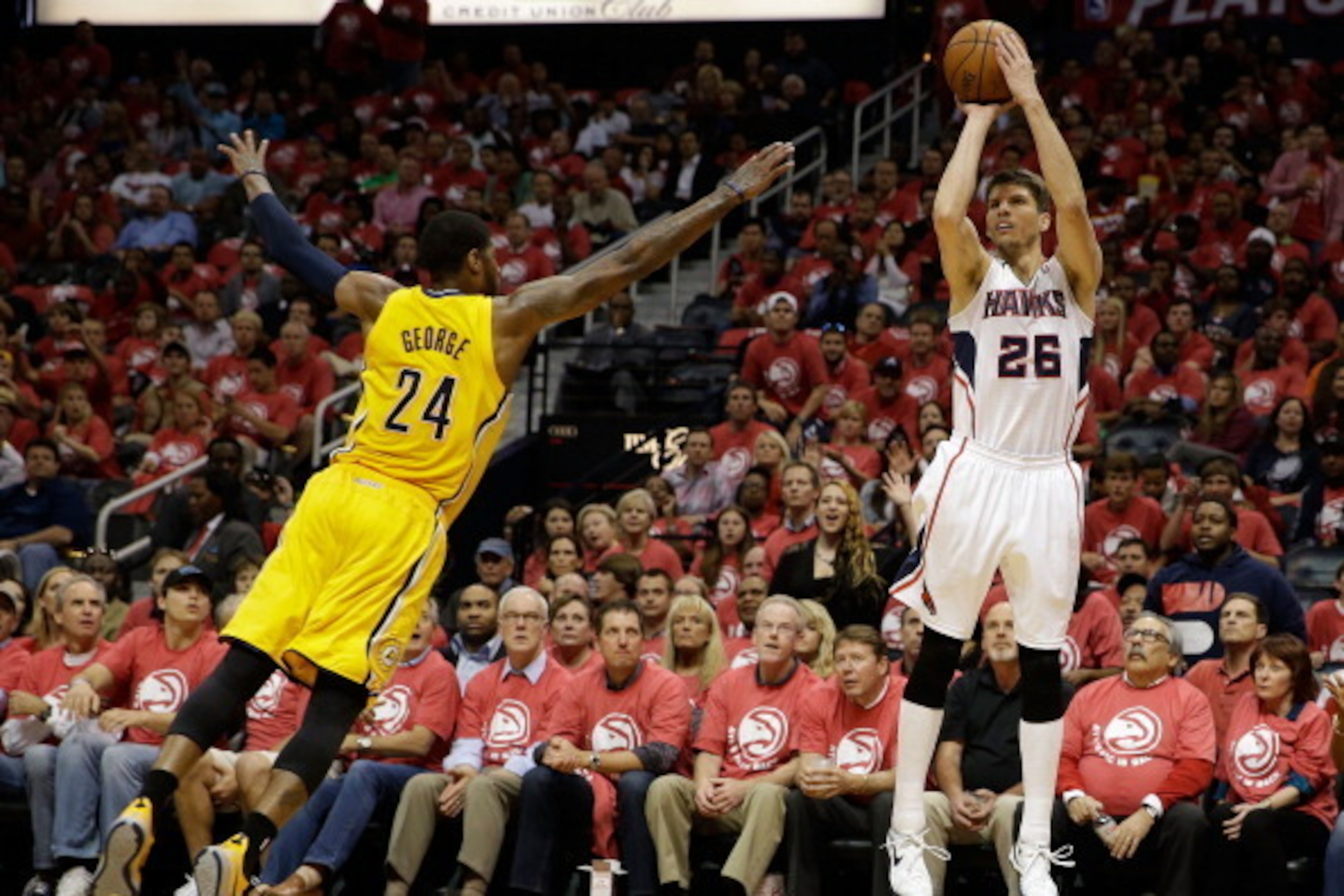 ATLANTA, GA - MAY 01:  Guard Kyle Korver #26 of the Atlanta Hawks shoots over against Paul George #24 of the  Indiana Pacers in Game 6 of the Eastern Conference Quarterfinals during the 2014 NBA Playoffs at Philips Arena on May 1, 2014 in Atlanta, Georgia