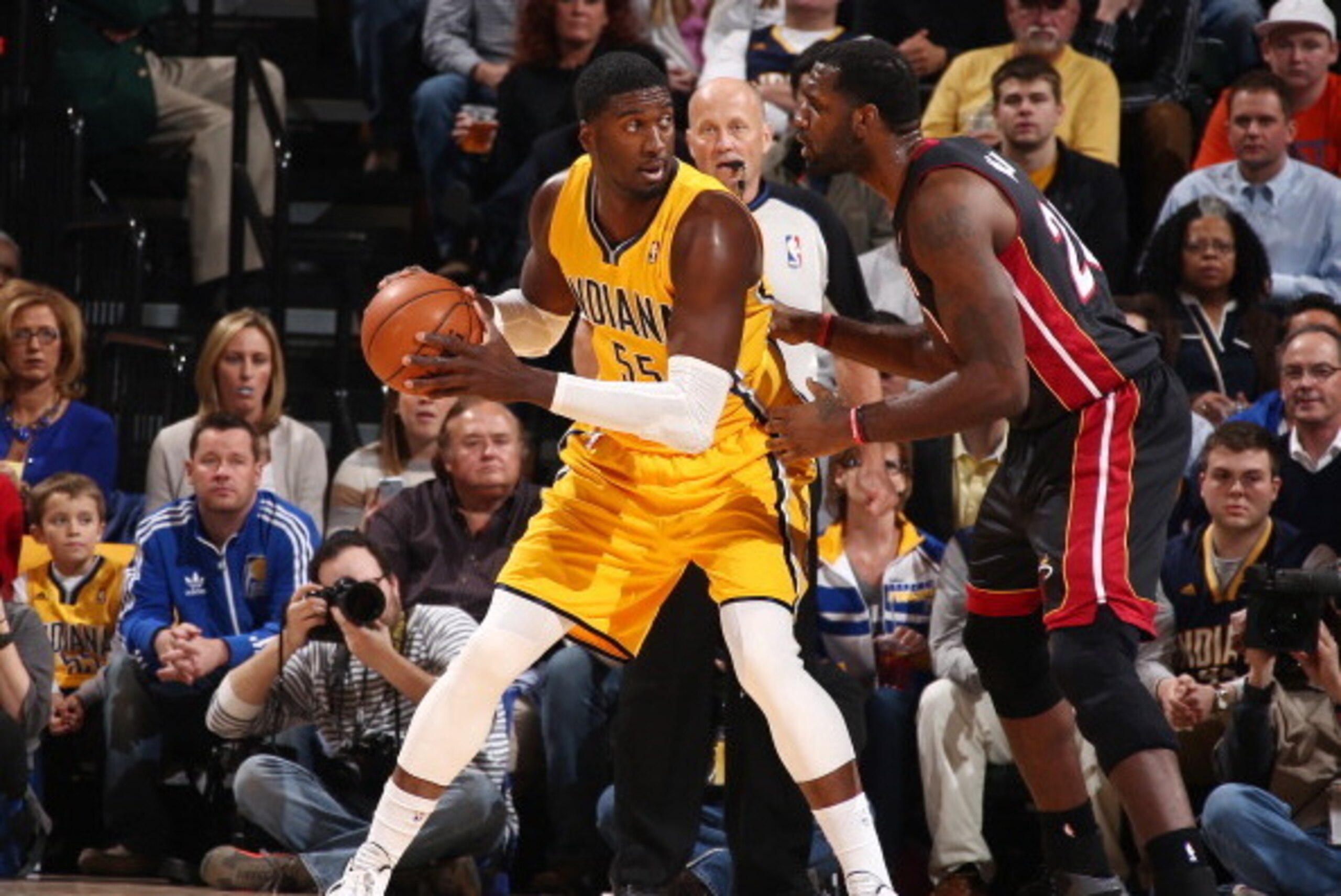 INDIANAPOLIS, IN - MARCH 26: Roy Hibbert #55 of the Indiana Pacers controls the ball against Greg Oden #20 of the Miami Heat during a game on March 26, 2014 at Bankers Life Fieldhouse in Indianapolis, IN.  NOTE TO USER: User expressly acknowledges and agr