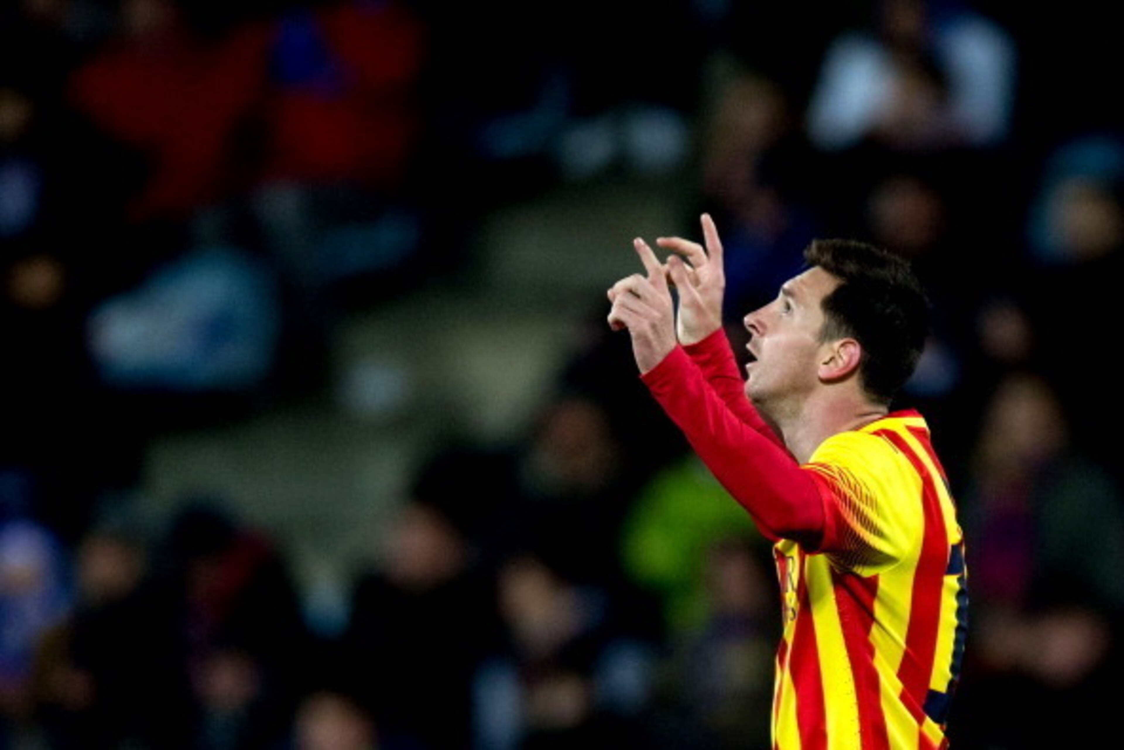 GETAFE, SPAIN - JANUARY 16: Lionel Messi of FC Barcelona celebrates scoring their opening goal during the Copa del Rey Round of 8 second leg match between Getafe CF and FC Barcelona at Coliseum Alfonso Perez on January 16, 2014 in Getafe, Spain.  (Photo b
