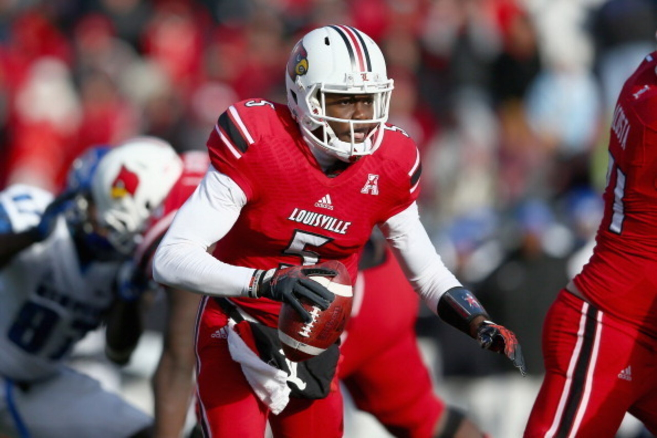 LOUISVILLE, KY - NOVEMBER 23:  Teddy Bridgewater #5 of the Louisville Cardinals runs with the ball during the game against the Memphis Tigers at Papa John's Cardinal Stadium on November 23, 2013 in Louisville, Kentucky.  (Photo by Andy Lyons/Getty Images)