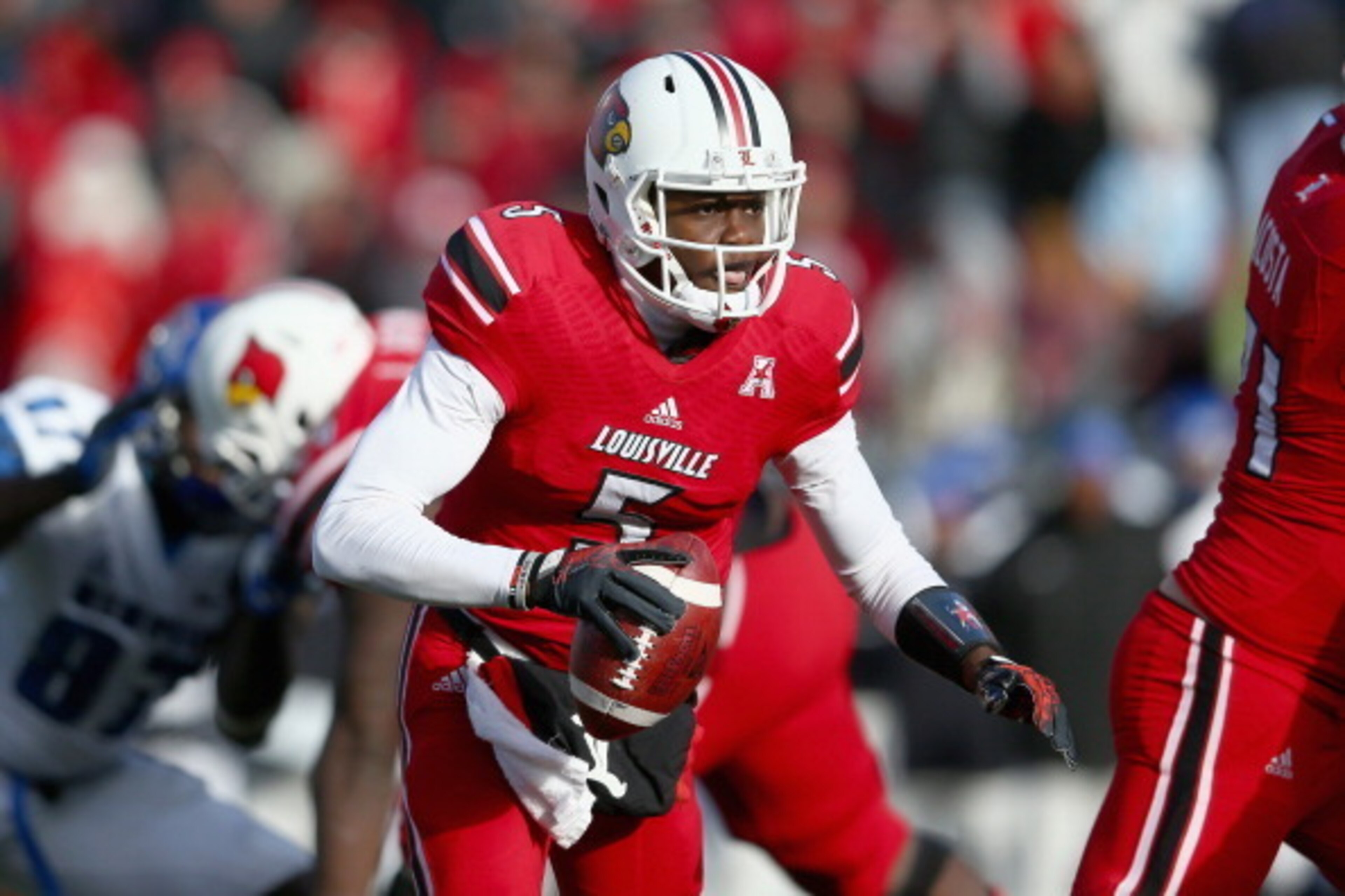 LOUISVILLE, KY - NOVEMBER 23:  Teddy Bridgewater #5 of the Louisville Cardinals runs with the ball during the game against the Memphis Tigers at Papa John's Cardinal Stadium on November 23, 2013 in Louisville, Kentucky.  (Photo by Andy Lyons/Getty Images)