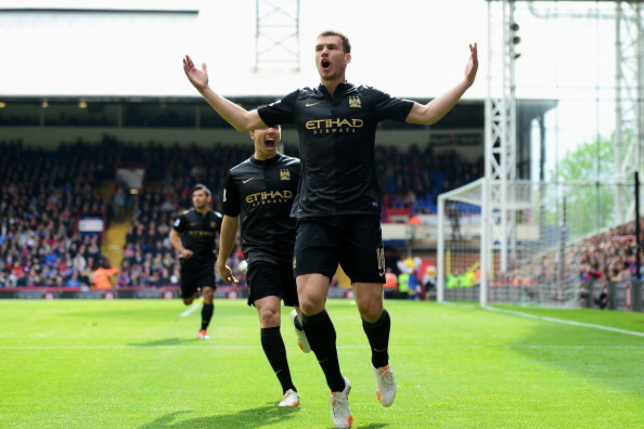 LONDON, ENGLAND - APRIL 27:  Edin Dzeko of Manchester City celebrates scoring the opening goal with Samir Nasri of Manchester City during the Barclays Premier League match between Crystal Palace and Manchester City at Selhurst Park on April 27, 2014 in Lo