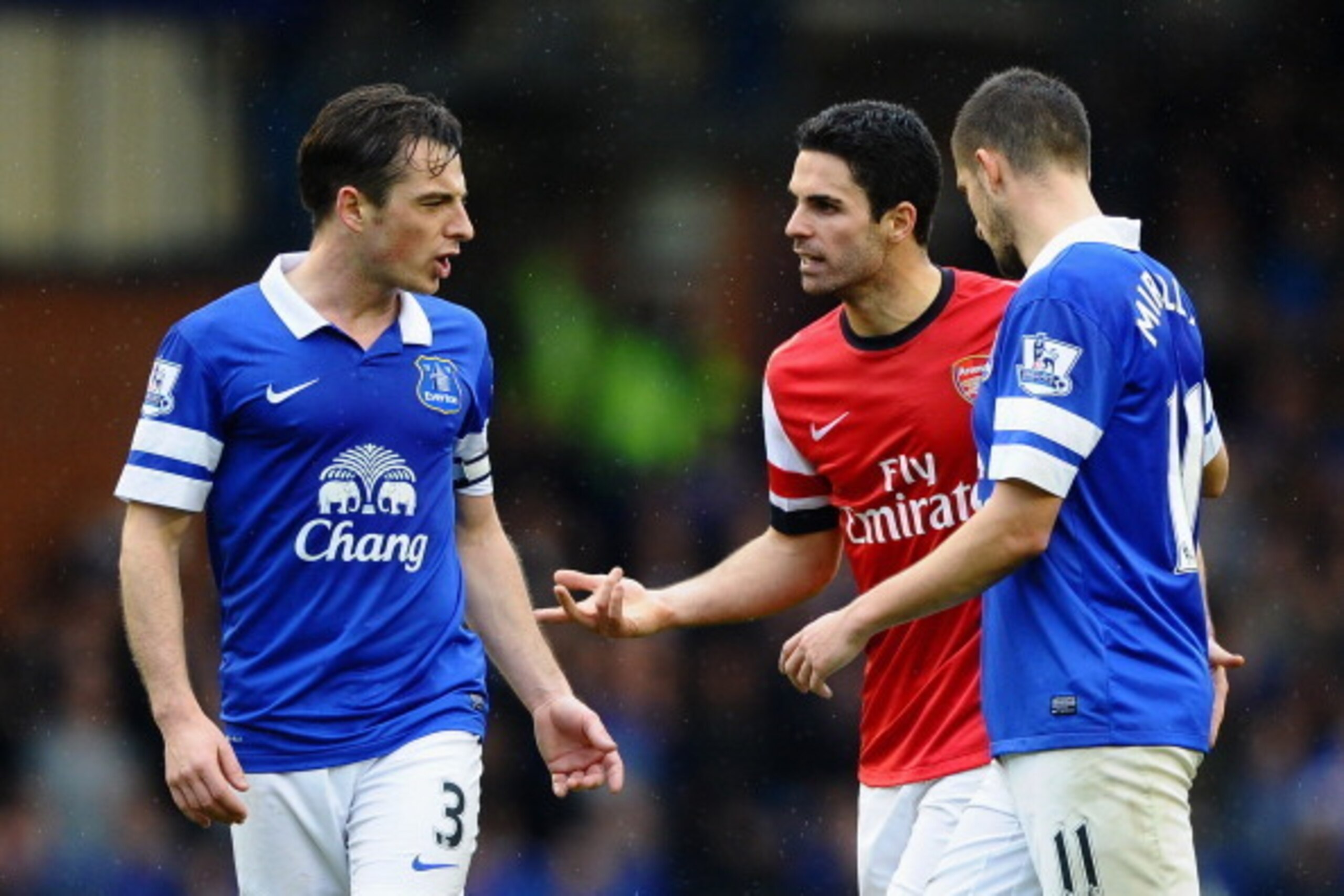 LIVERPOOL, ENGLAND - APRIL 06:  Mikel Arteta of Arsenal clashes with Leighton Baines of Everton during the Barclays Premier League match between Everton and Arsenal at Goodison Park on April 6, 2014 in Liverpool, England.  (Photo by Laurence Griffiths/Get