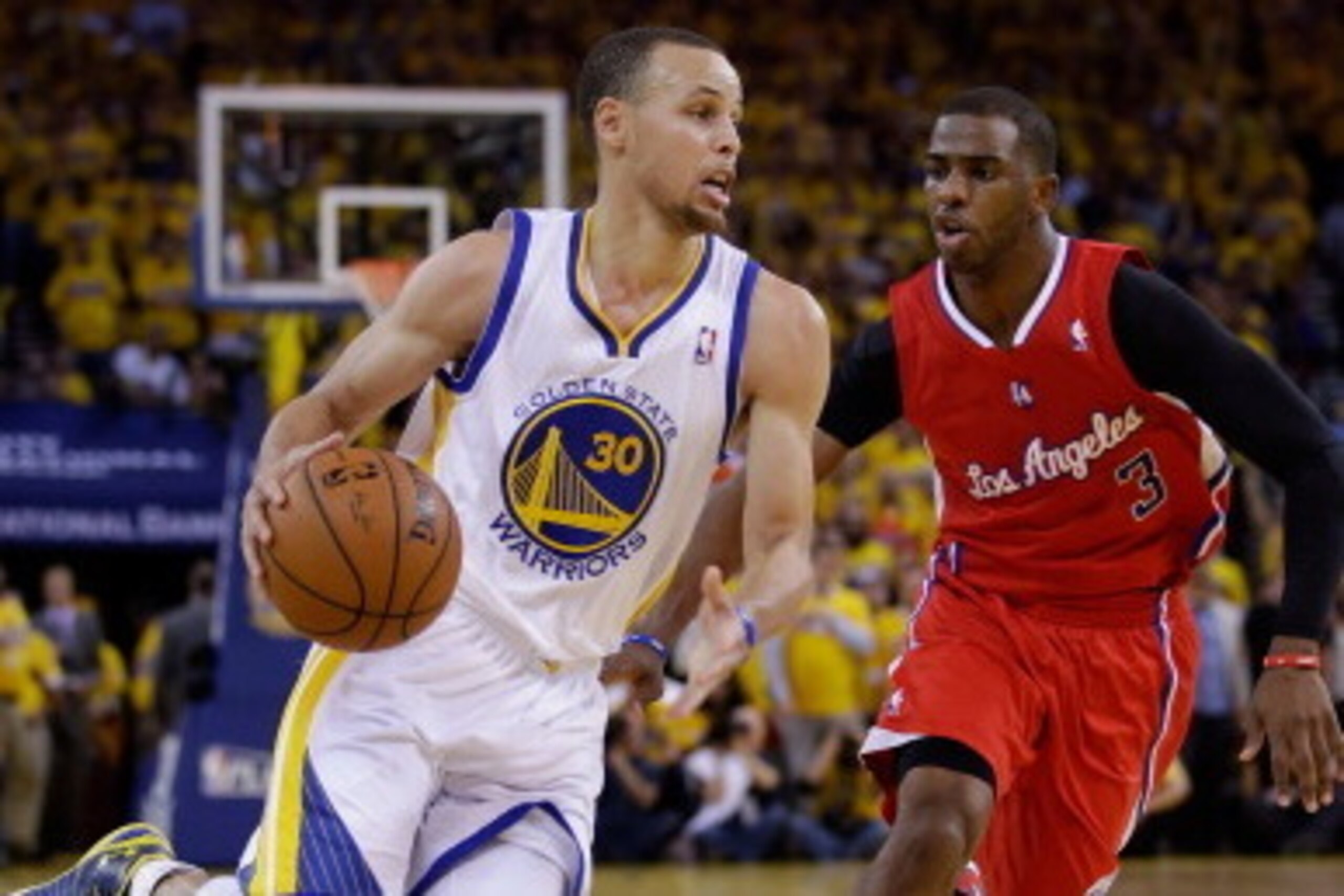 OAKLAND, CA - MAY 01:  Stephen Curry #30 of the Golden State Warriors drives on Chris Paul #3 of the Los Angeles Clippers in Game Six of the Western Conference Quarterfinals during the 2014 NBA Playoffs at ORACLE Arena on May 1, 2014 in Oakland, Californi